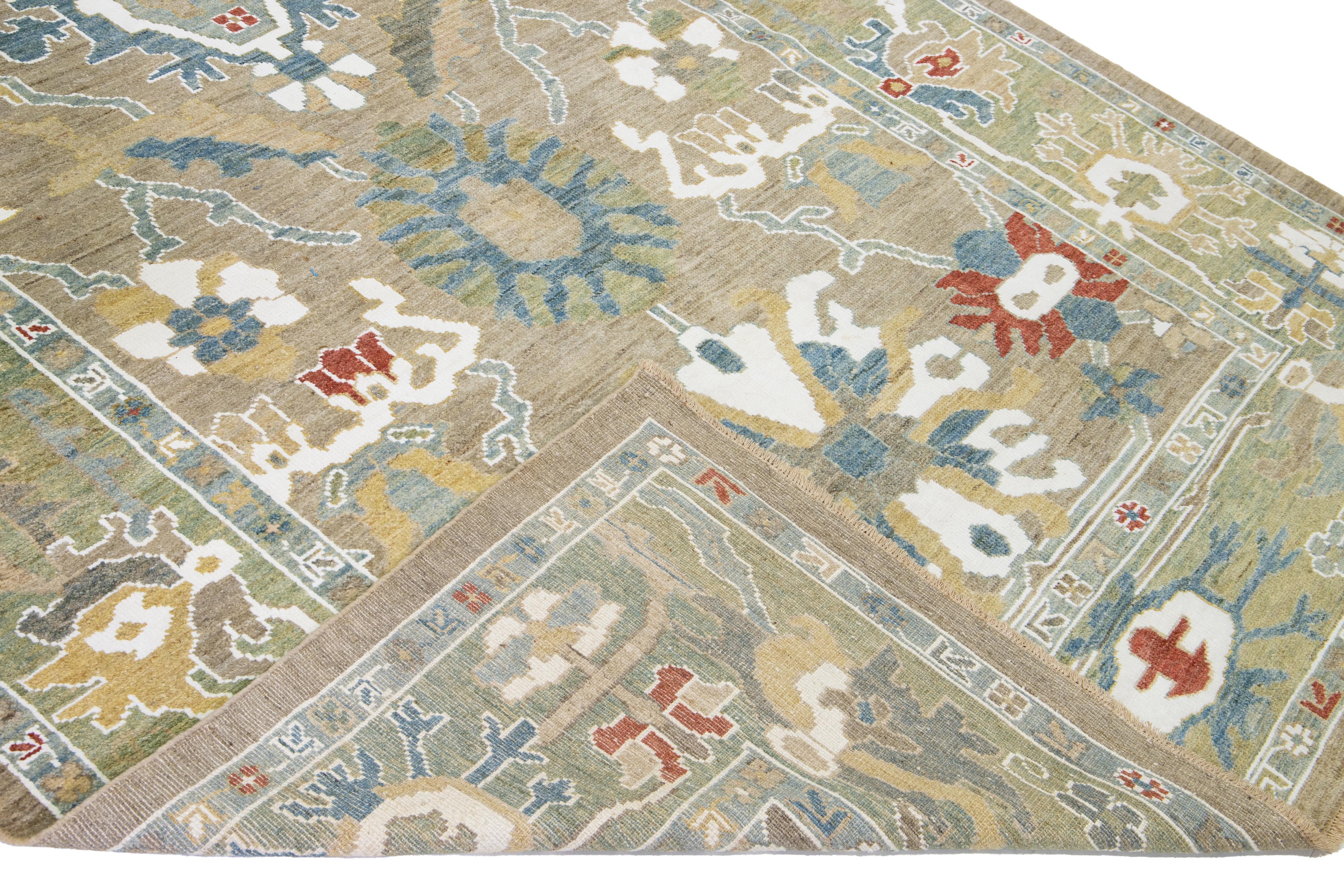 Modern Mahal hand-knotted wool runner with a brown field. This piece has a green frame and multicolor accent colors that features a gorgeous all-over floral design.

This rug measures: 6'9