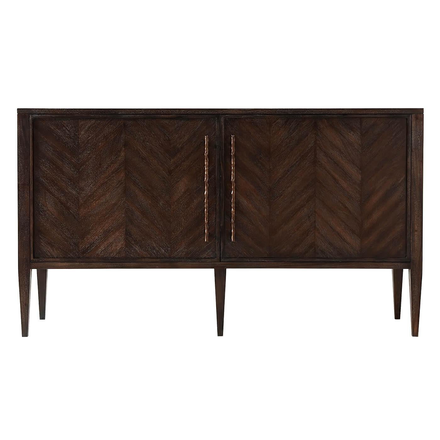 Modern mahogany herringbone parquetry panelled door cabinet with cast branch form handles, interior adjustable shelves and square tapered legs.
Dimensions: 60