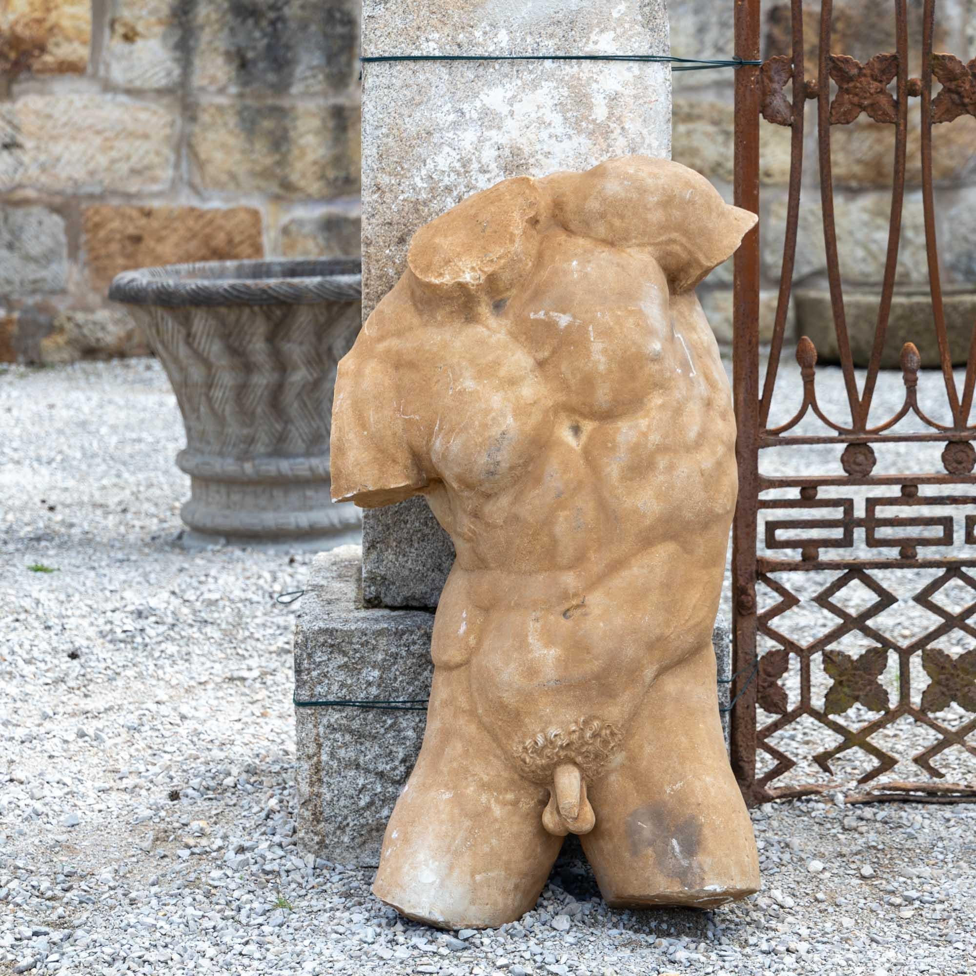 Larger-than-life male torso made of marble. The modern torso is modelled on antiquity and has a beige patina.