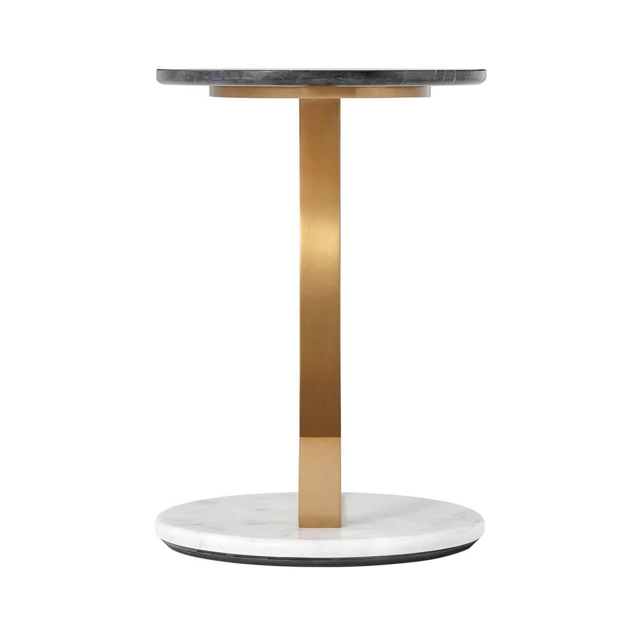 A Modern marble and brass side table with a black marble top and white marble base with a brass support in the form of an open sail.
Dimensions: 15