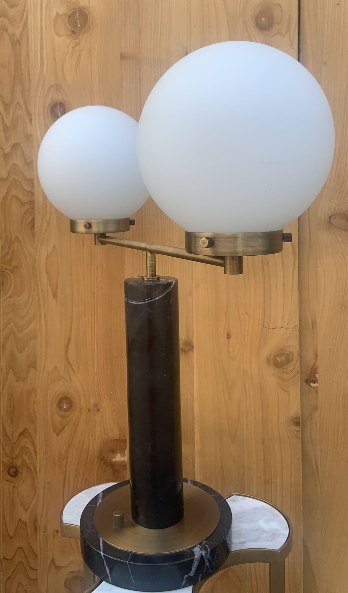 Modern Marble and Brass Table Lamps with 2 White Ball Shades

The lamp heavy. Works great. We also have a matching lamp with 1 white ball shades. 

Circa 2018

Dimensions 

H 25” (top of the ball)
H 17” (top of the brass bar)
D 8.5” Base 
D 7