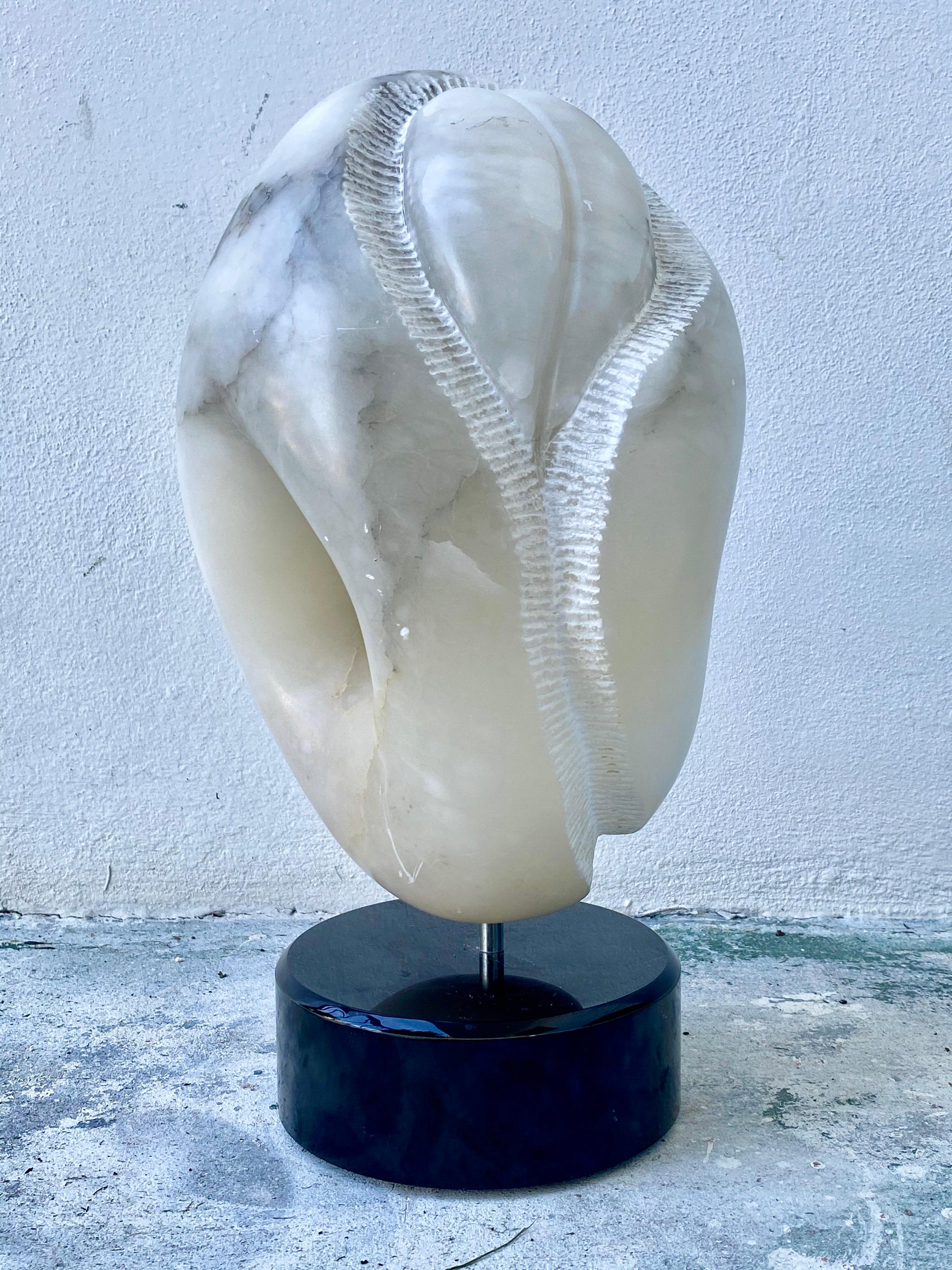 Abstract marble sculpture circa 1980s from Palm Beach estate. Carved marble on rotating stone base. No signature or date. In very good condition, very little wear by age.