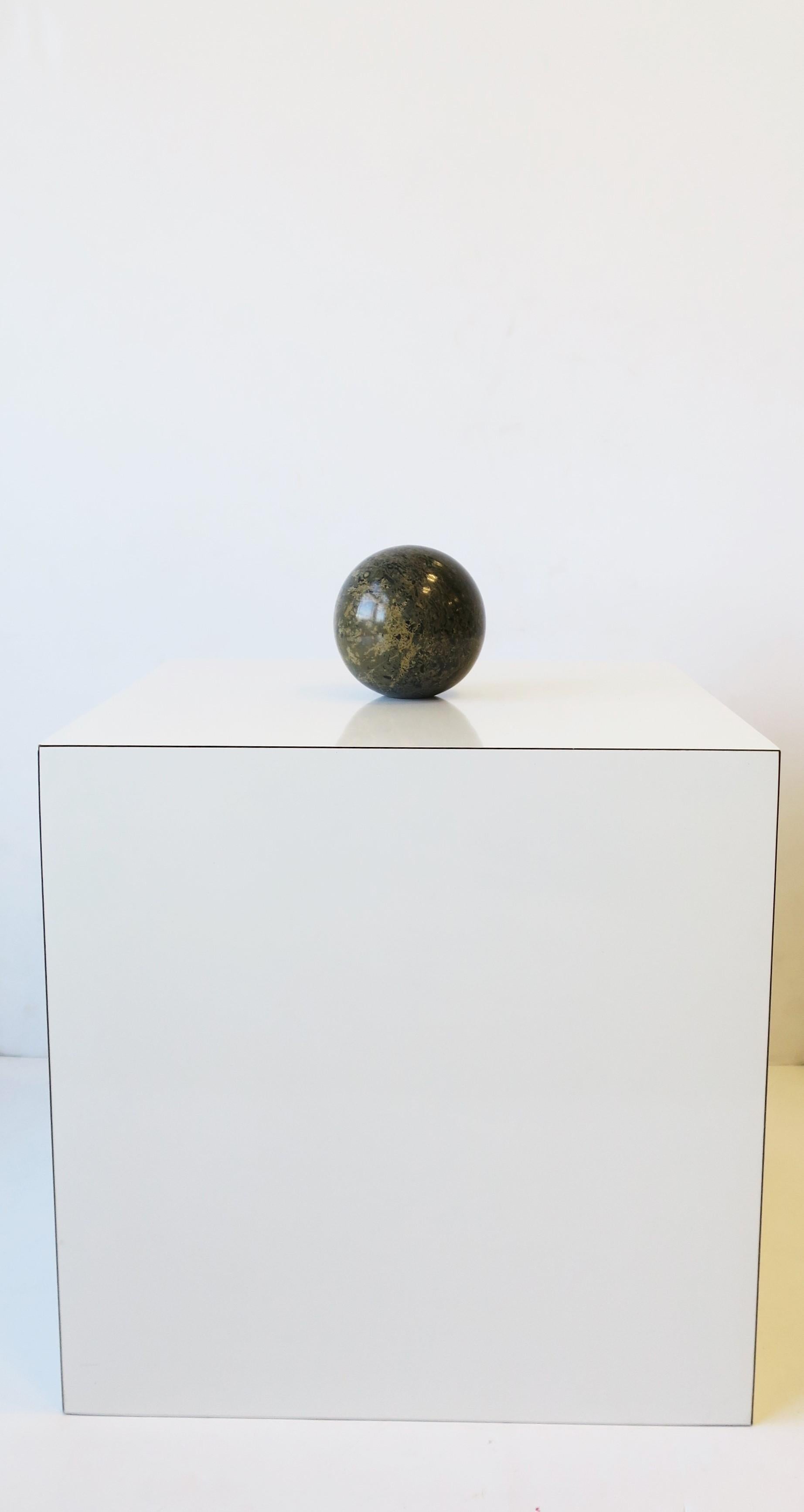 A substantial Art Deco Modern marble round ball sphere in black, dark grey and tan hues, circa late-20th century, 1970s or a little later. A great decorative object as shown in images. Flat bottom for stability. Dimensions: 4