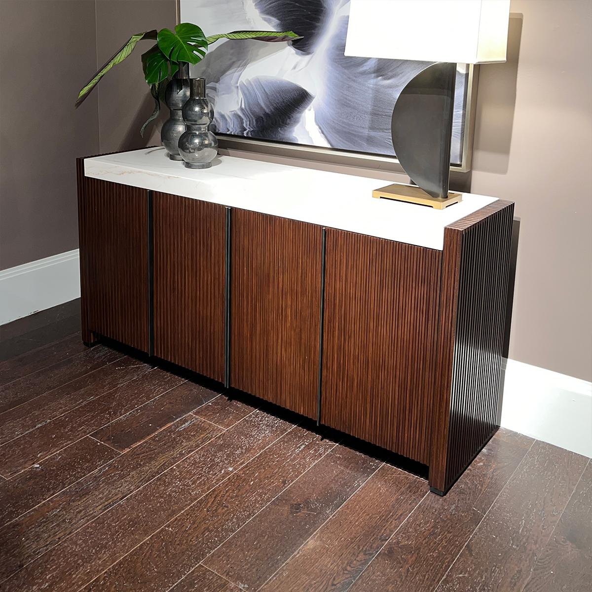 Featuring a rhythmic reeded pattern in warm brown finish, a marble top and brass finished hardware. The cabinet creates the perfect combination of organic sophistication and contemporary style.

Dimensions: 72
