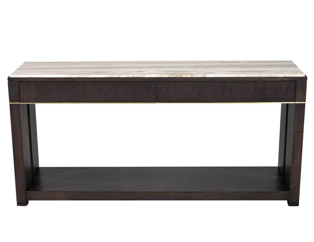 Introducing our stunning modern “Al Contro” natural stone top console table, a perfect blend of style and functionality. This exquisite piece features a warm-toned natural stone top adorned with unique veining details that create a captivating