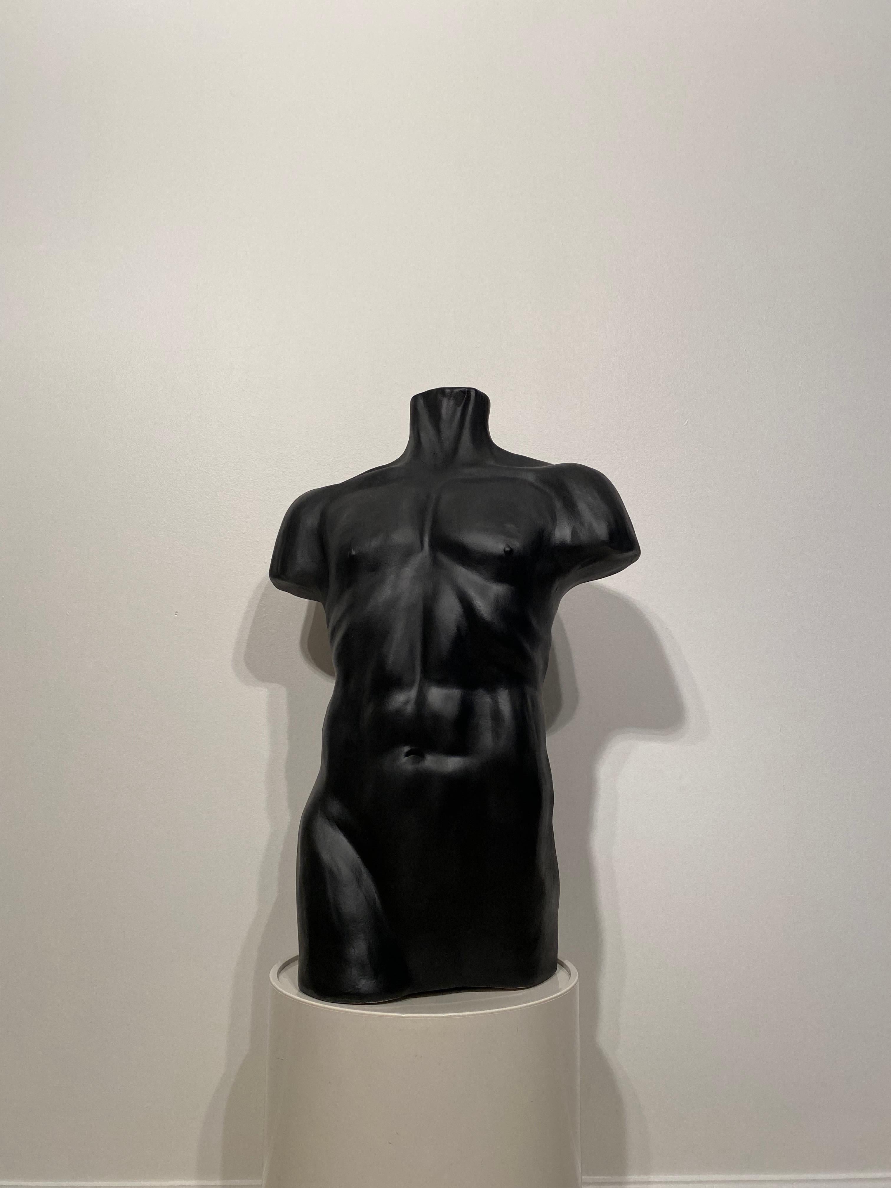 Modern matte black ceramic torso.