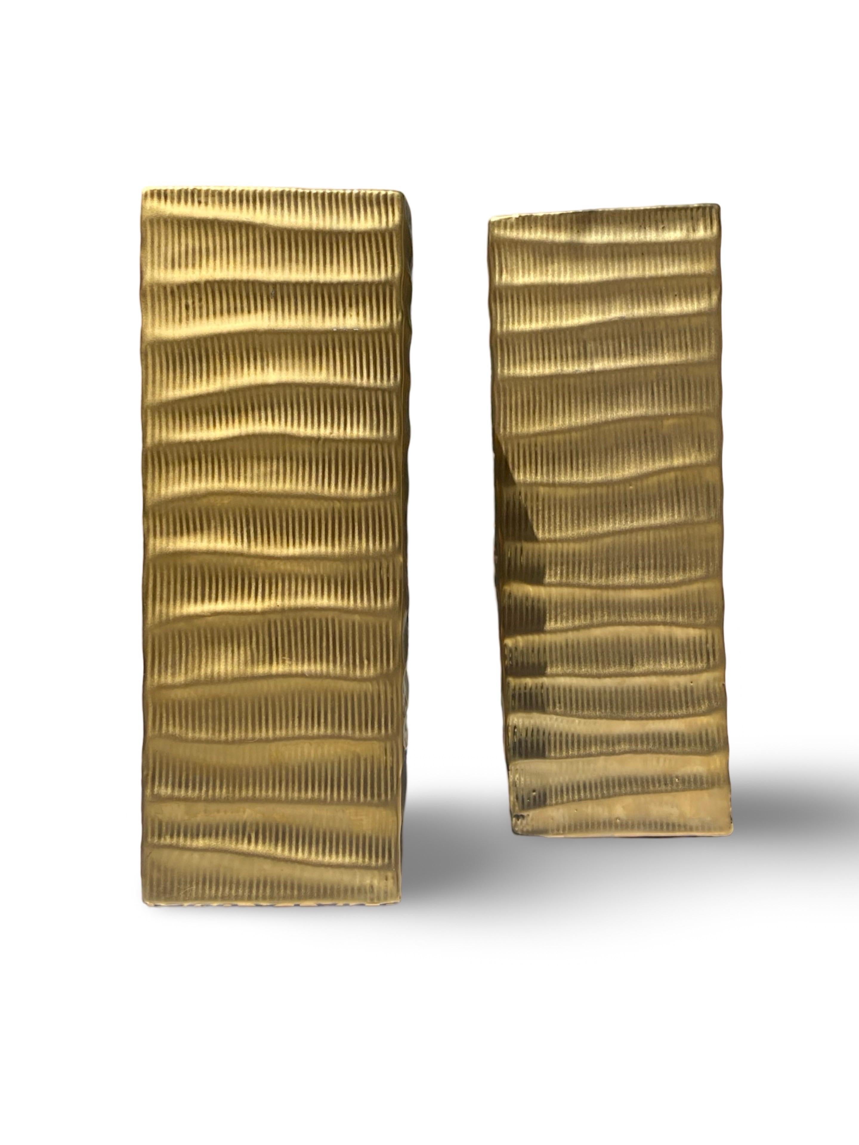 A pair of modern matte gold vases. They look like a pair of skyscrapers! Purchased from an interior designer’s Palm Springs area estate sale. Done in the style of 80s Donna Karan home collection and the jewelry she did with icon Robert Lee Morris. I