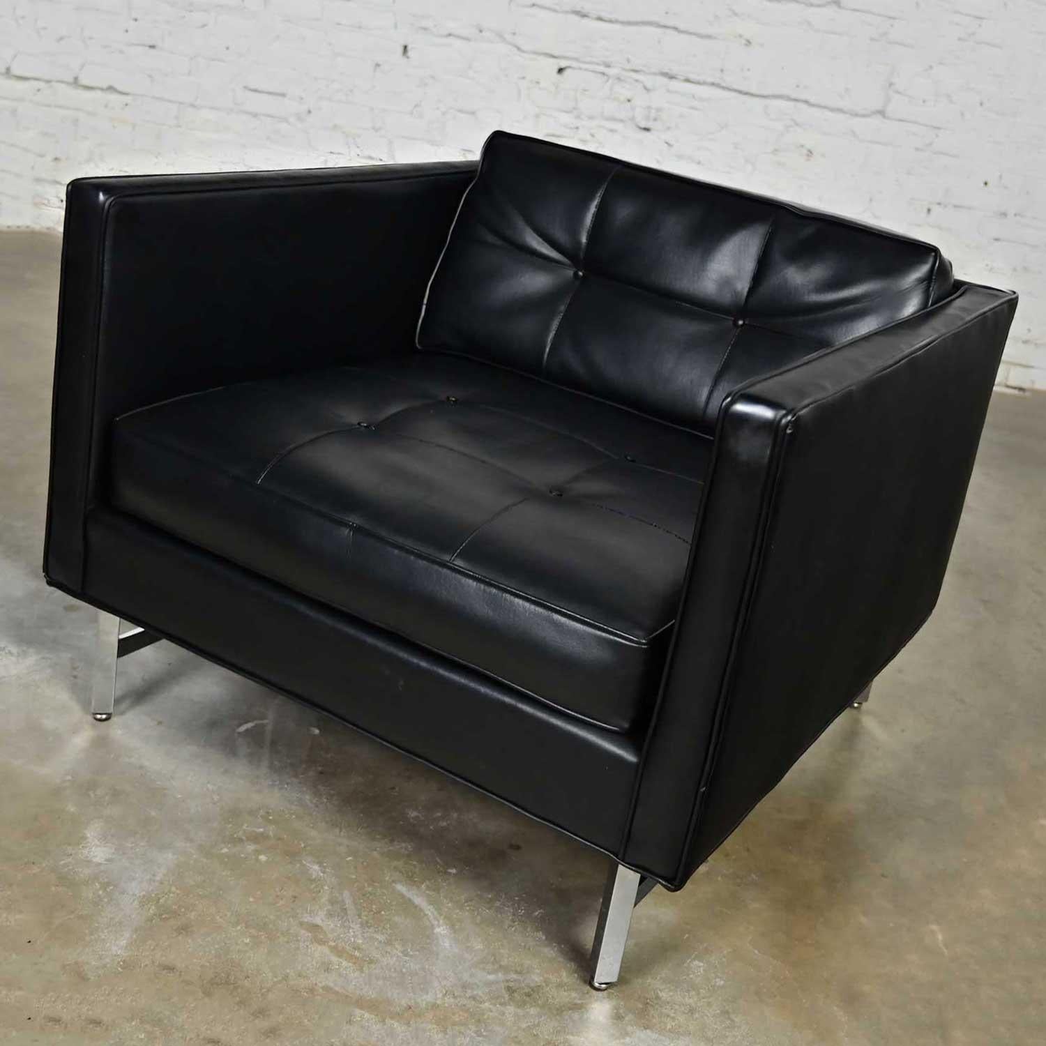 Handsome vintage modern Maurice Villency button black vinyl faux leather cube armchair with chrome legs. Beautiful condition, keeping in mind that this is vintage and not new so will have signs of use and wear. The bottom of the seat has been