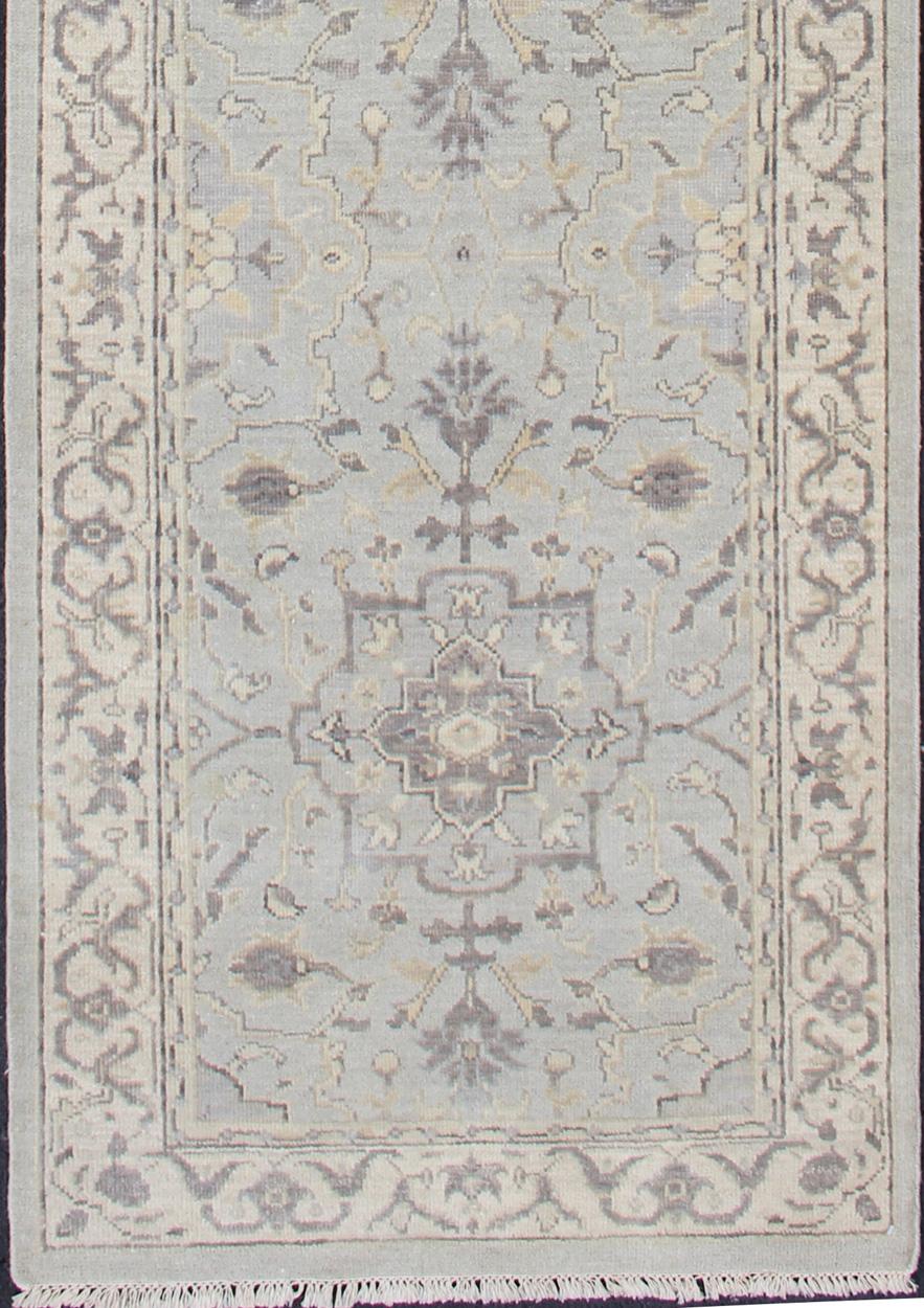 Oushak rug with Seafoam, blue, gray, green and cream in a neutral color palette and medallion design, rug/OB-10287863, country of origin / type: India/ Oushak

This hand knotted Oushak rug features a beautiful medallion design rendered in grays,
