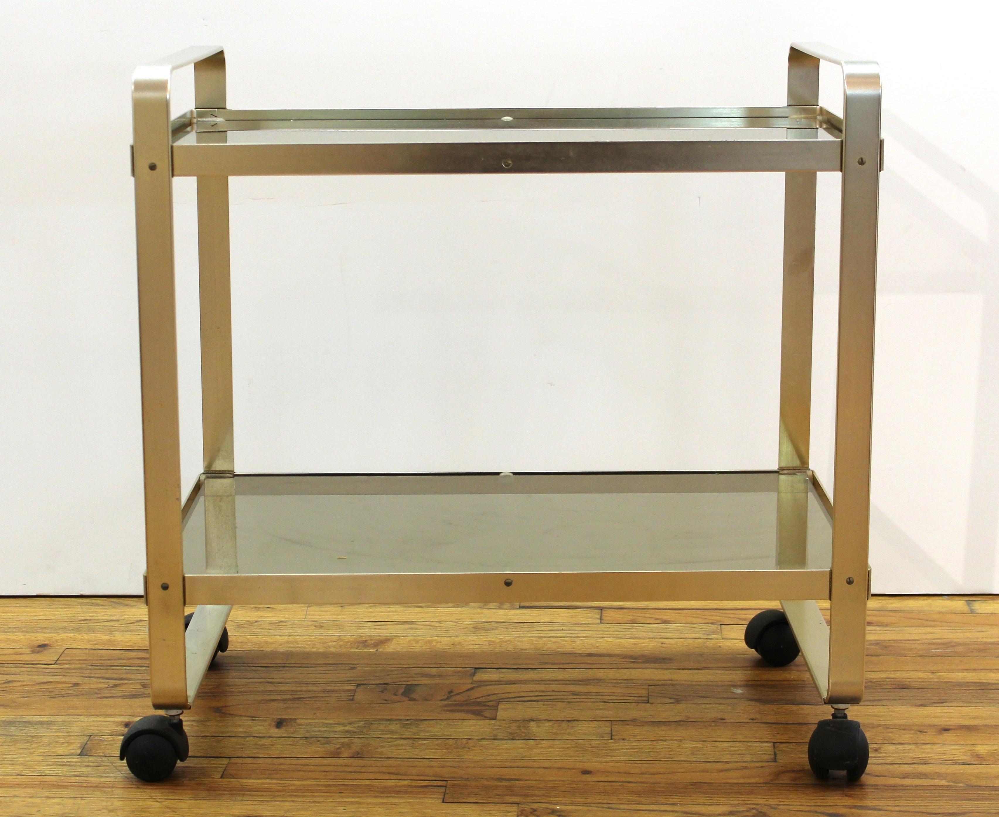 Modern metal bar cart on casters with two glass levels, circa 1970's-1980's.
