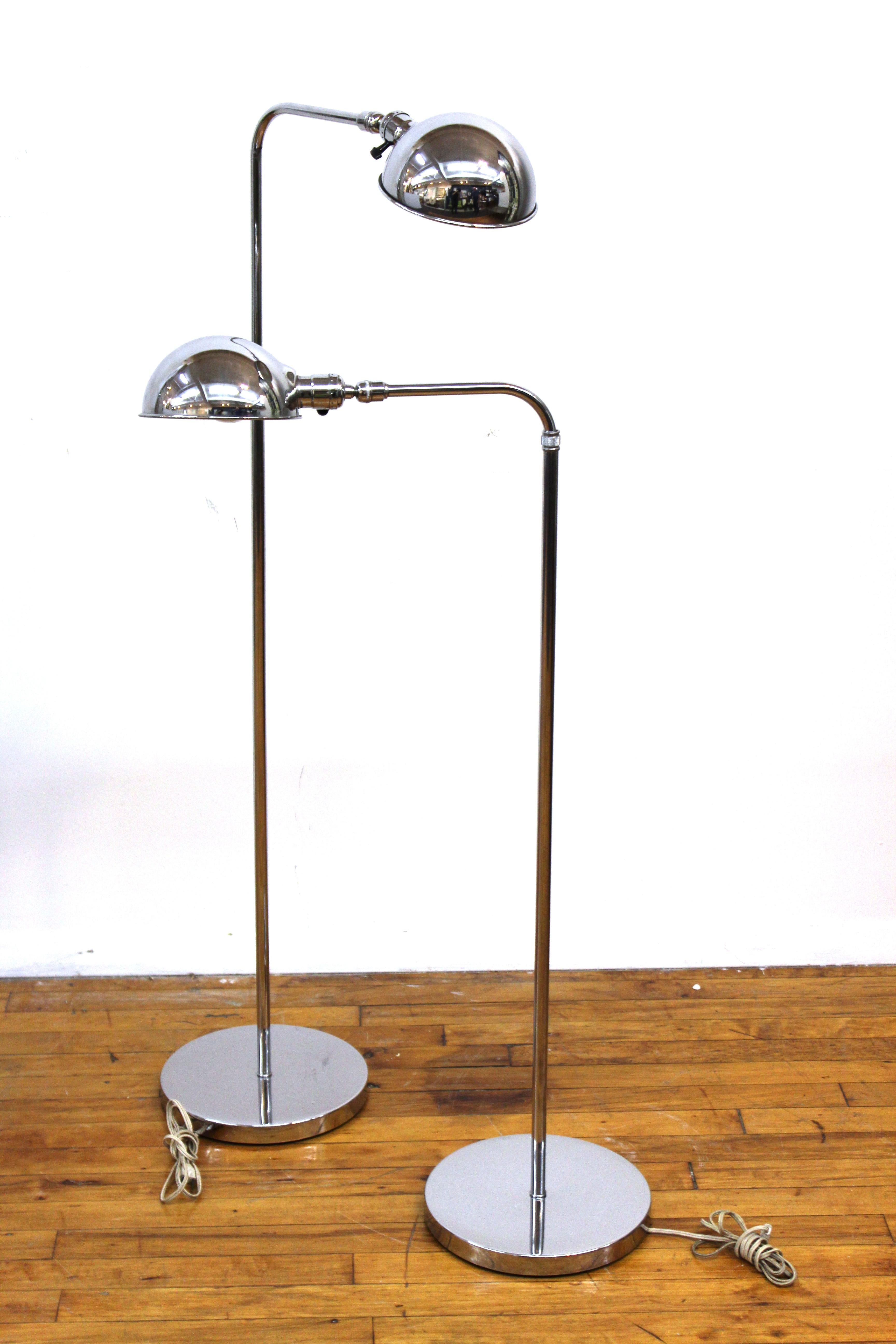 Modern pair of metal floor lamps or reading lamps with adjustable height and moving heads. Likely made during the late 20th century, the pair is in great vintage condition with age-appropriate wear and use.