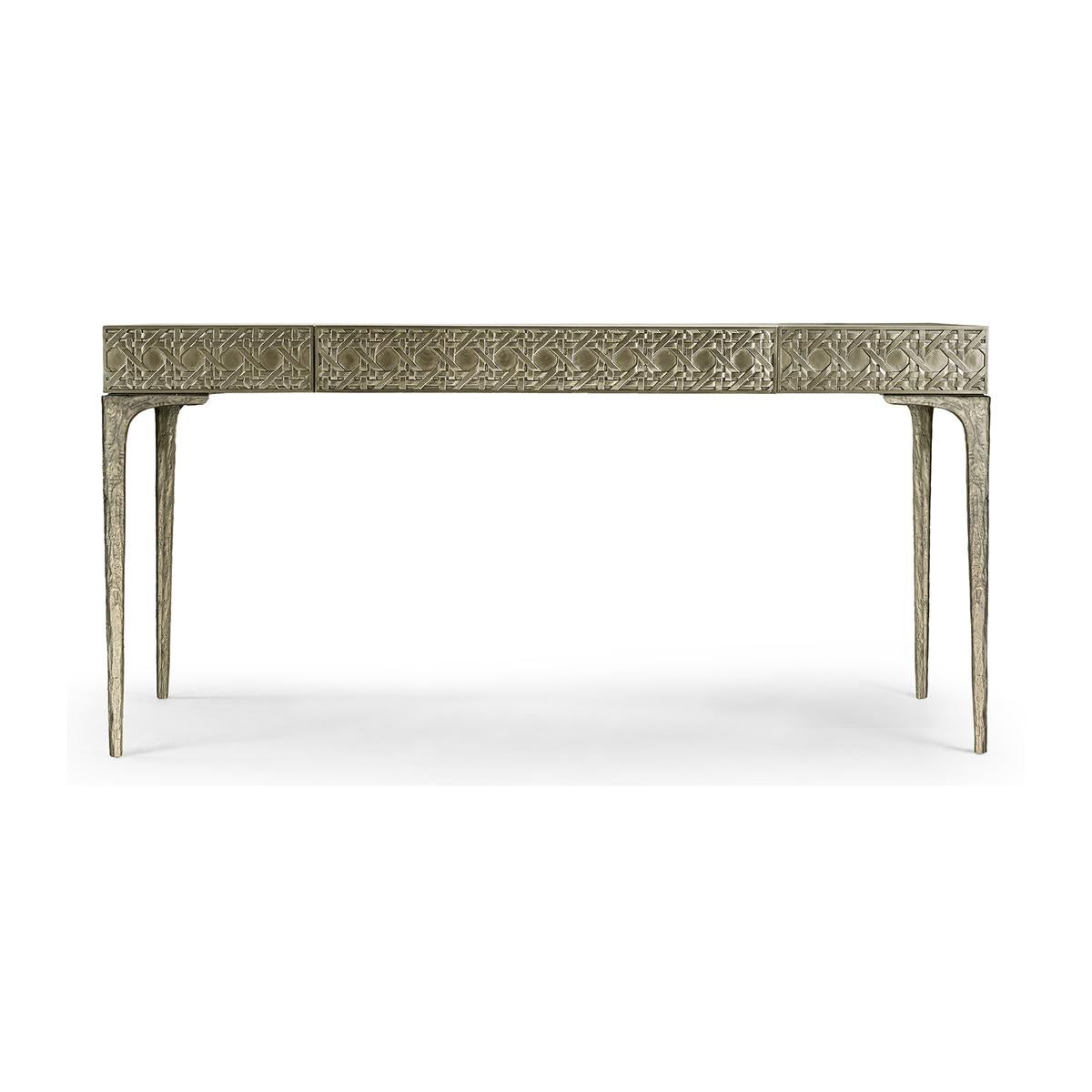 Modern Metal Leather top desk, featuring a digitally carved, traditional woven cane design. The carved metal desk boasts mesmerizing textural layers.

The carved aluminum case is paired flawlessly with a drop-in leather top and organically