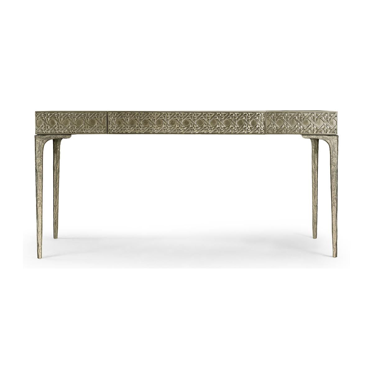 Bureau moderne en métal avec dessus en cuir, présentant un motif traditionnel de canne tressée, sculpté numériquement. Le bureau en métal sculpté présente des couches de textures fascinantes.

Le boîtier en aluminium sculpté est parfaitement