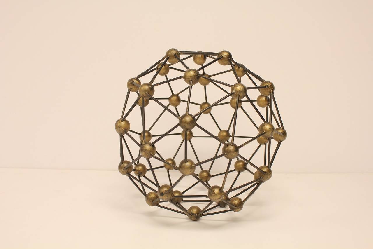 Modern metal molecule sphere sculpture.