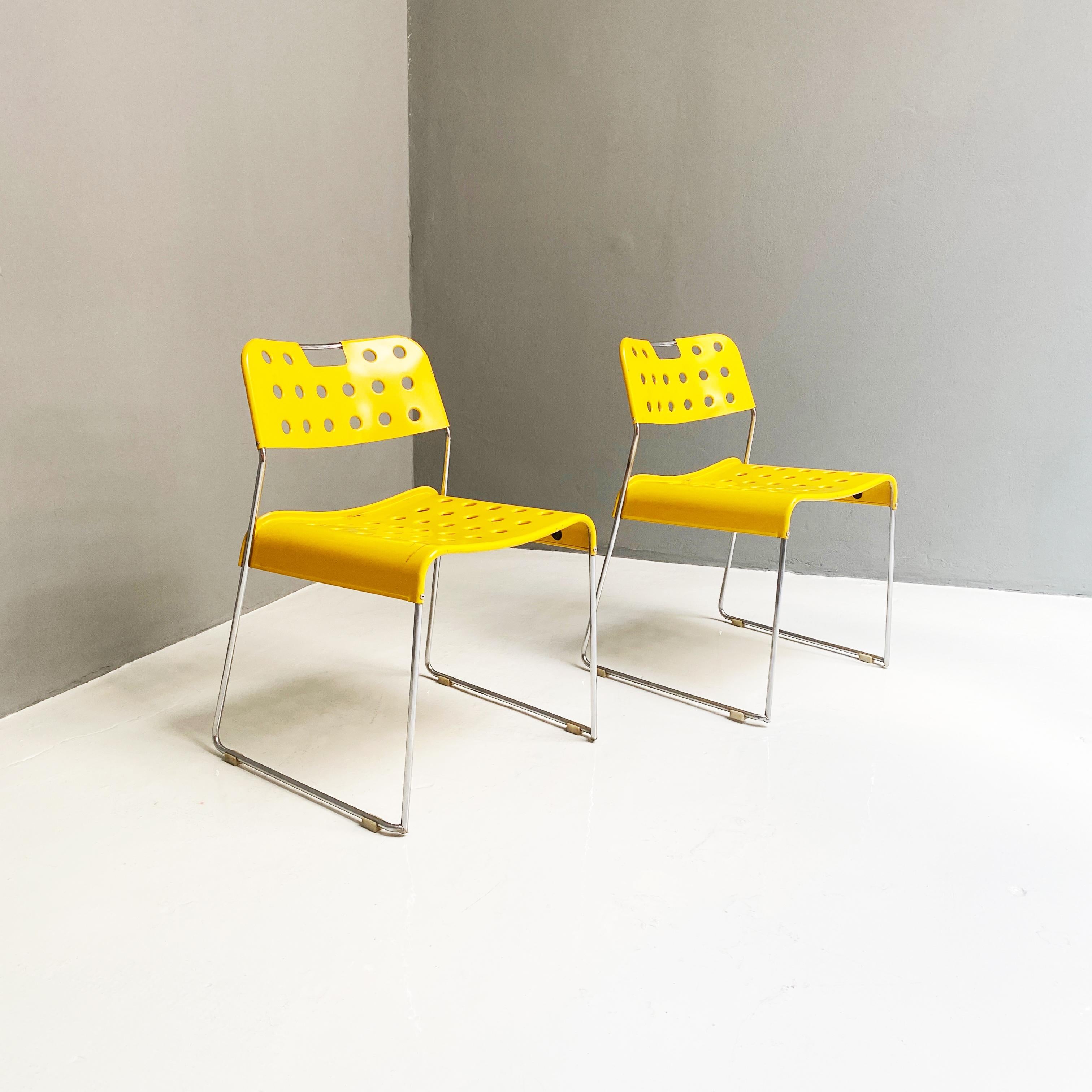 Yellow chairs Omstak by Rodney Kinsman for Bieffeplast, 1970s 
Stackable chairs Omstak model, with structure in steel rod and seats with circular holes in yellow metal. Designed by Rodney Kinsman for Bieffeplast in the 1970s.

Good structural
