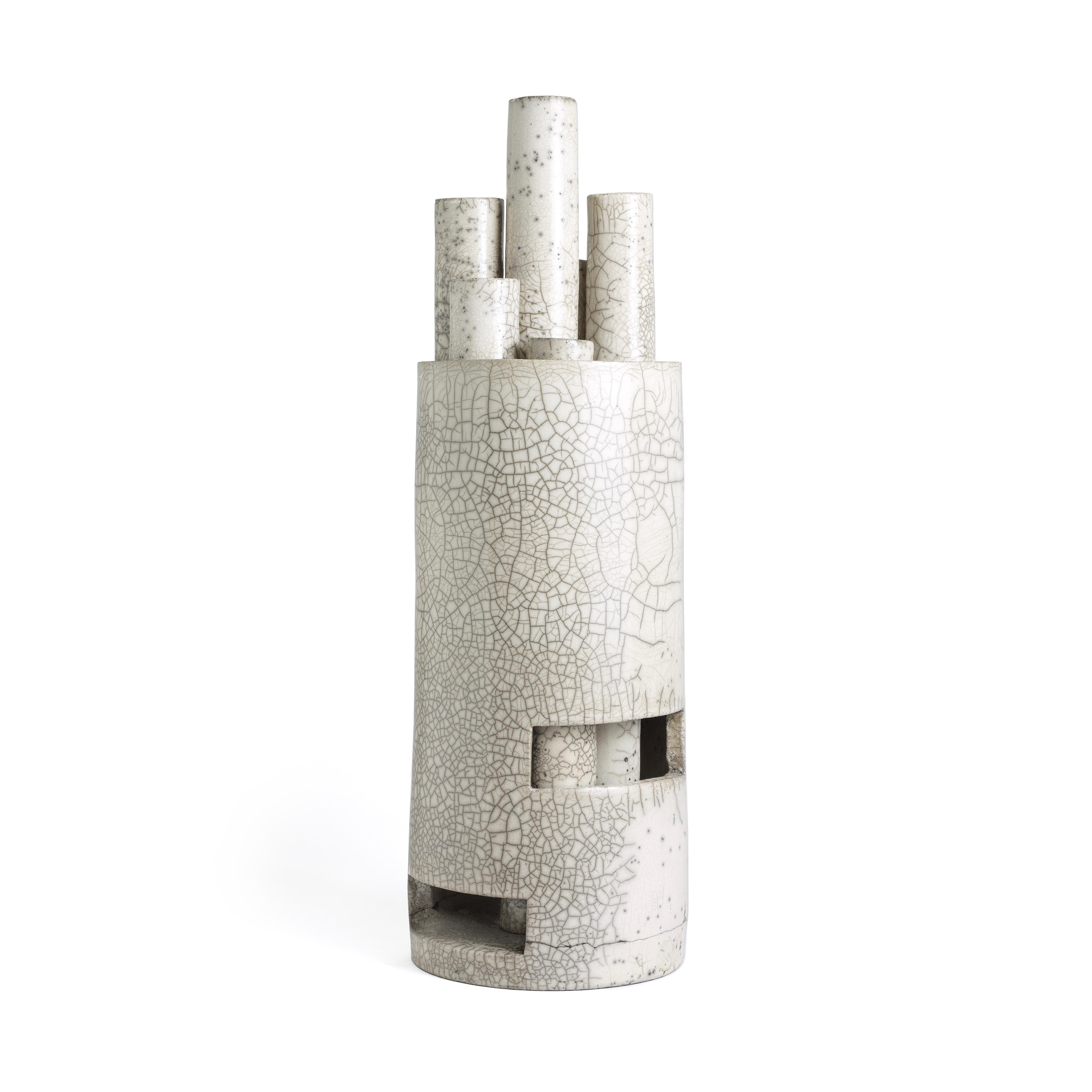 Metropolis sculptures represent civilization at different stages, starting from contained elements of smaller dimensions getting taller. The cracklè exalt the geometric shapes of these candle holders, result of the Japanese Firing technique. This