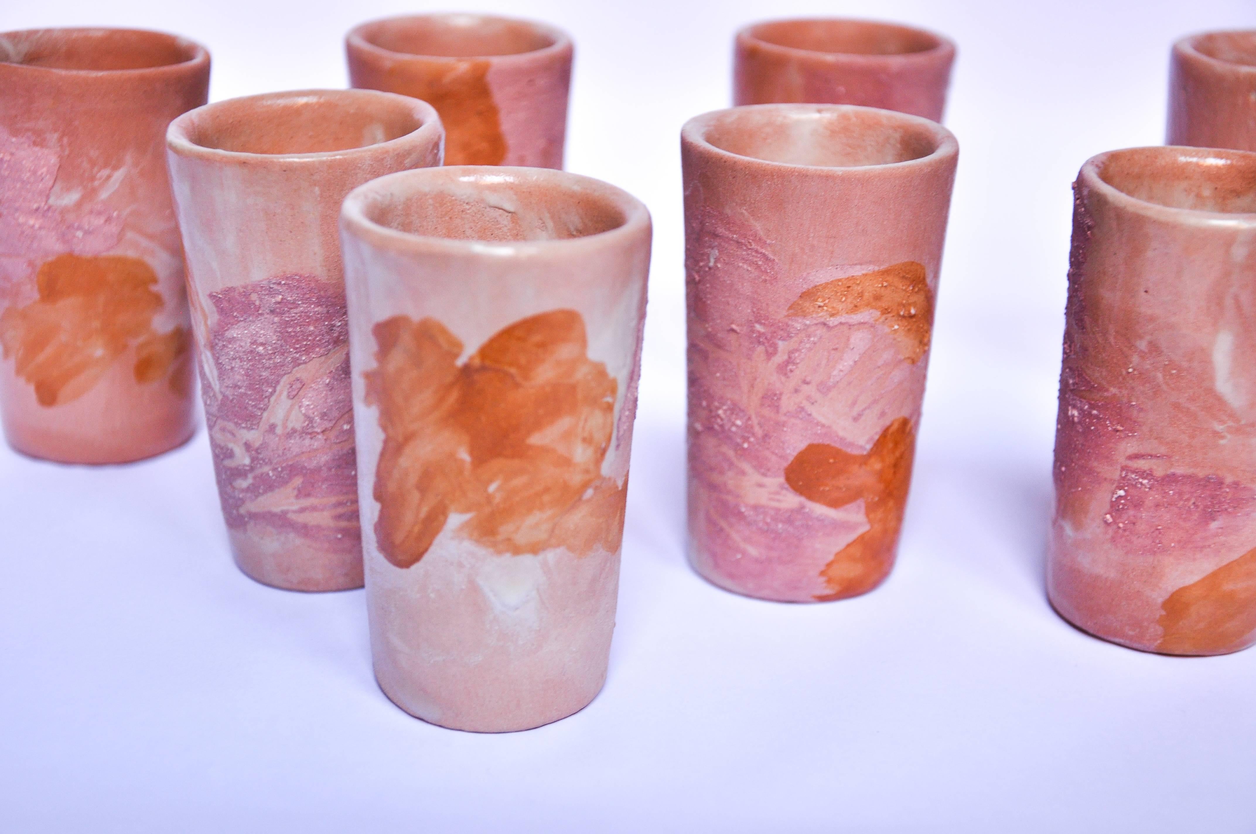 Ceramic nine-shot glass set with modern earth design by Lorenzo Lorenzzo.
 