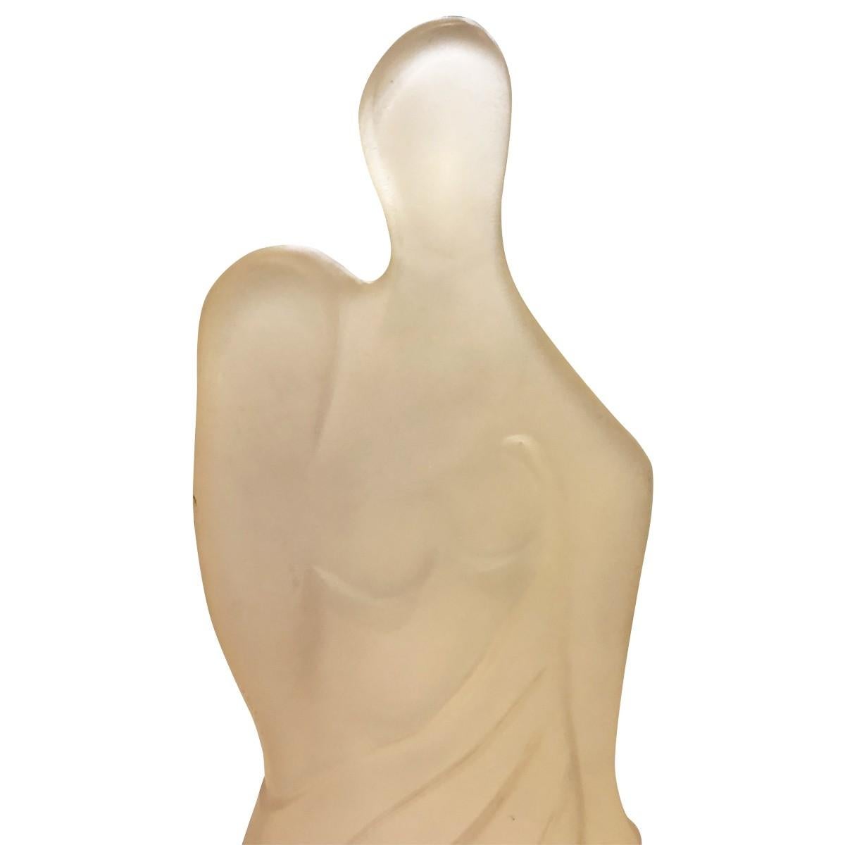 This elegant sculpture will undoubtedly upgrade any space. Made from translucent resin, it features a mother and child. Comes with a black wood painted base.

Dimensions
Width 8.50