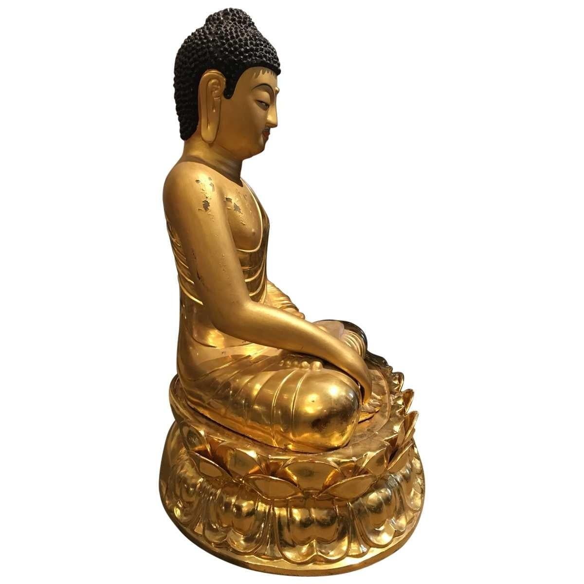 Buddha, gilded base. One of the world's oldest traditions, Chinese art spans thousands of years and numerous eras. Traditionally, Chinese art and decor is defined by a decorative, yet seemingly understated quality done using earth tones and a linear