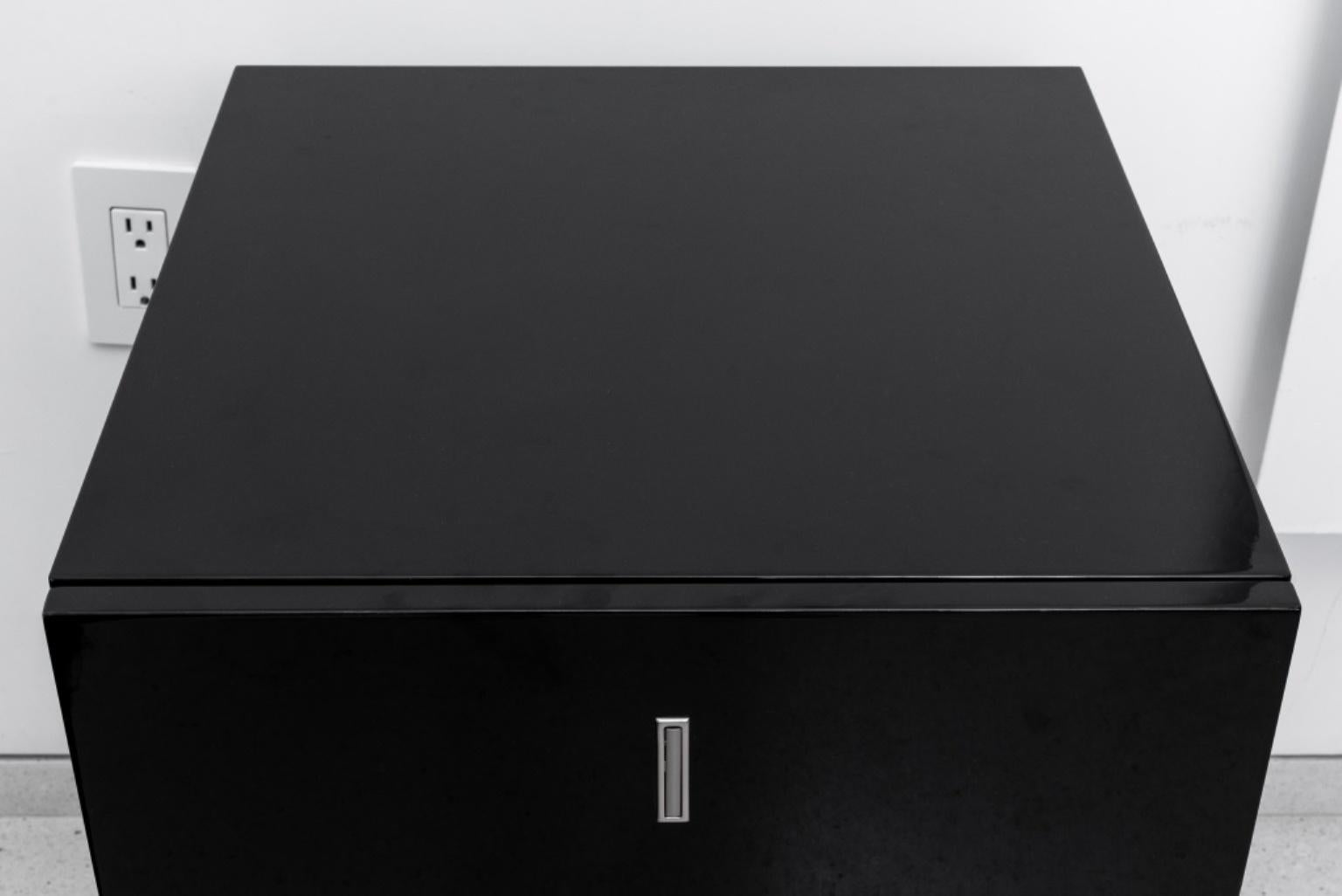 Modern Minimalist black lacquer filing cabinet with two drawers, mounted on wheels. 

Dealer: S138XX