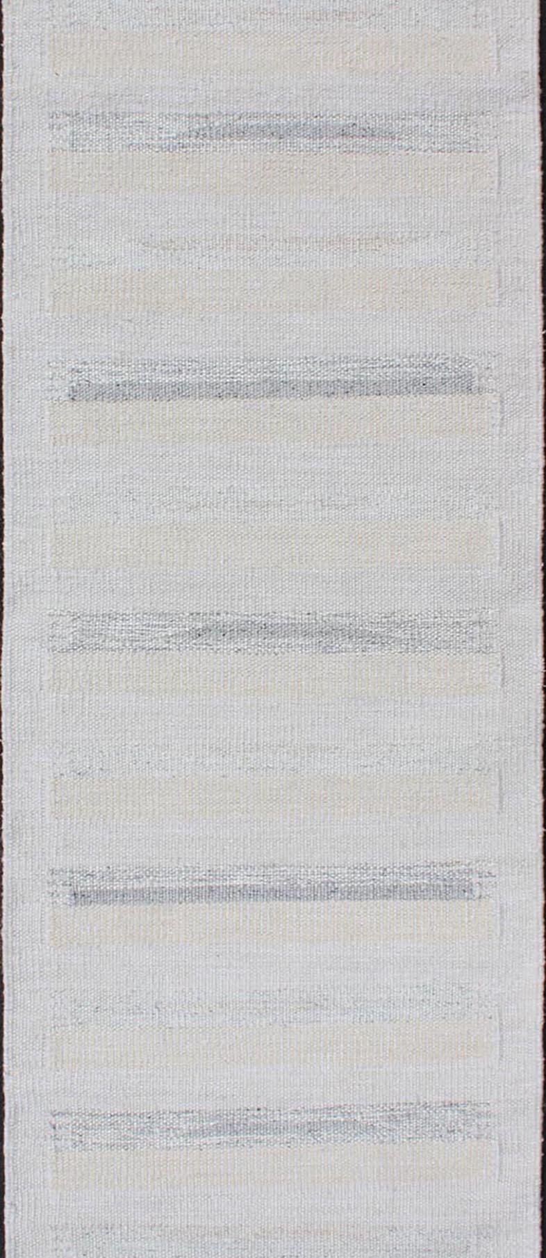 Minimalist modern design flat weave rug with stripes in cream, ivory and gray. Rug RJK-18680, country of origin / type: India / Scandinavian flat-weave.

Measures: 2'8 x 10'3 

This modern flat-weave style is inspired by the work of modern