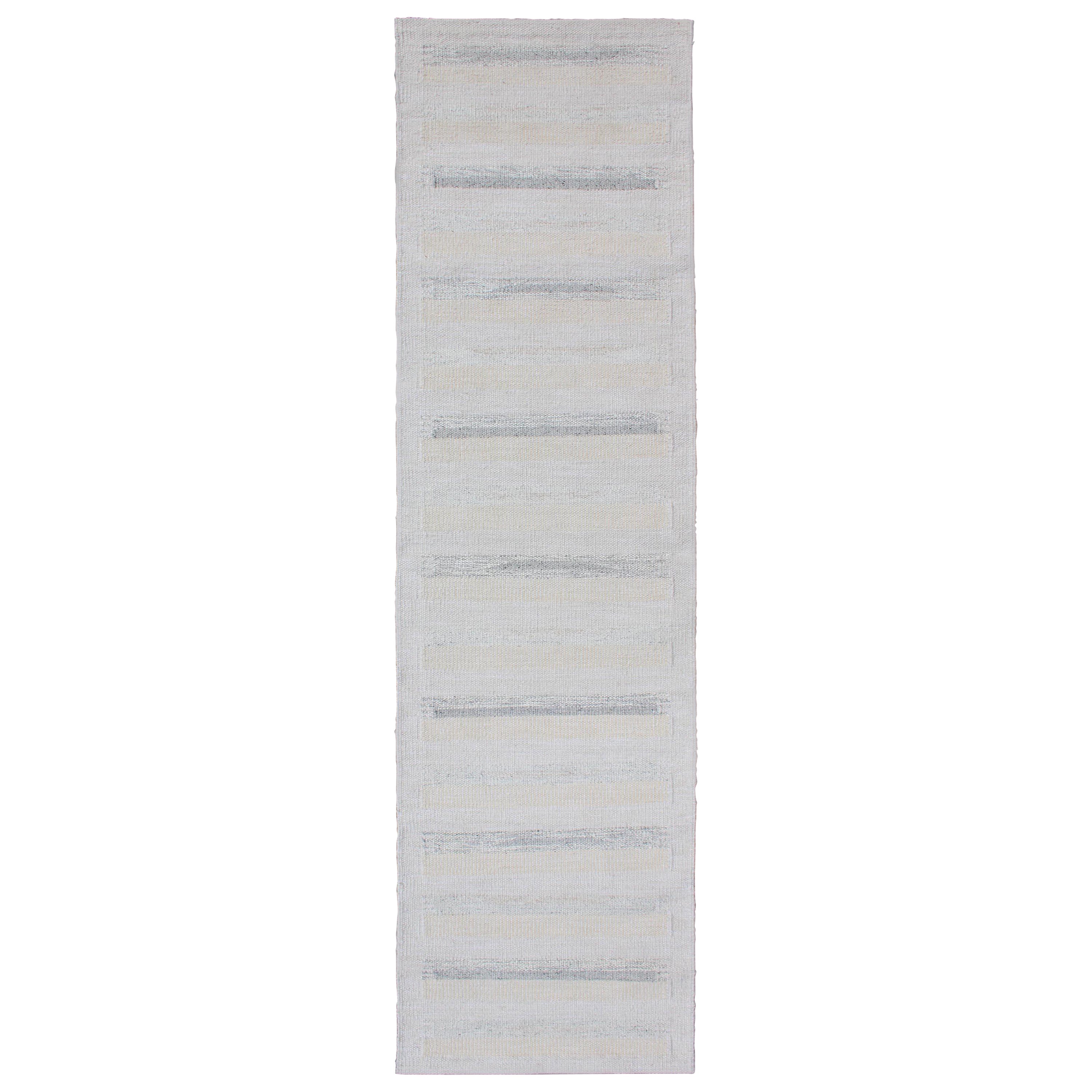 Tappeto moderno a trama piatta dal design minimalista in grigio, crema e avorio