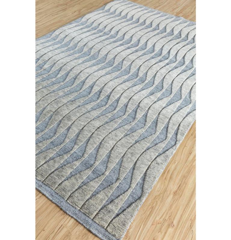 Embrace the allure of modern elegance with our handmade rug collection, where minimalism meets impact. This captivating piece features repetitive patterns that mesmerize without overwhelming, creating a contemporary masterpiece for your space.