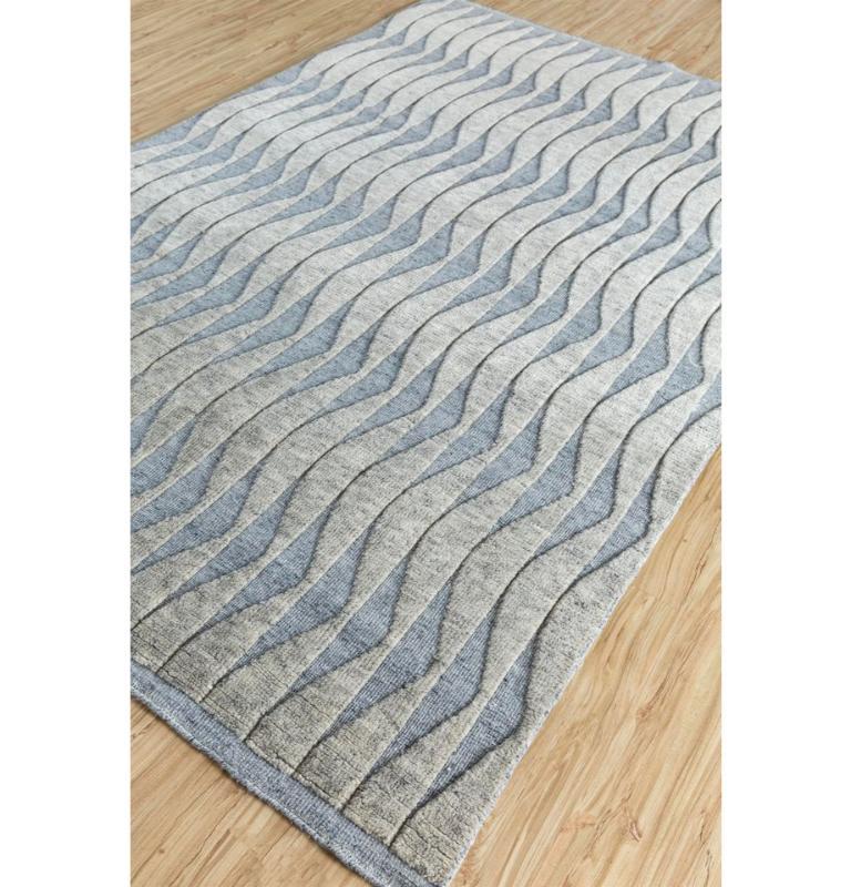 Embrace the allure of modern elegance with our handmade rug collection, where minimalism meets impact. This captivating piece features repetitive patterns that mesmerize without overwhelming, creating a contemporary masterpiece for your space.