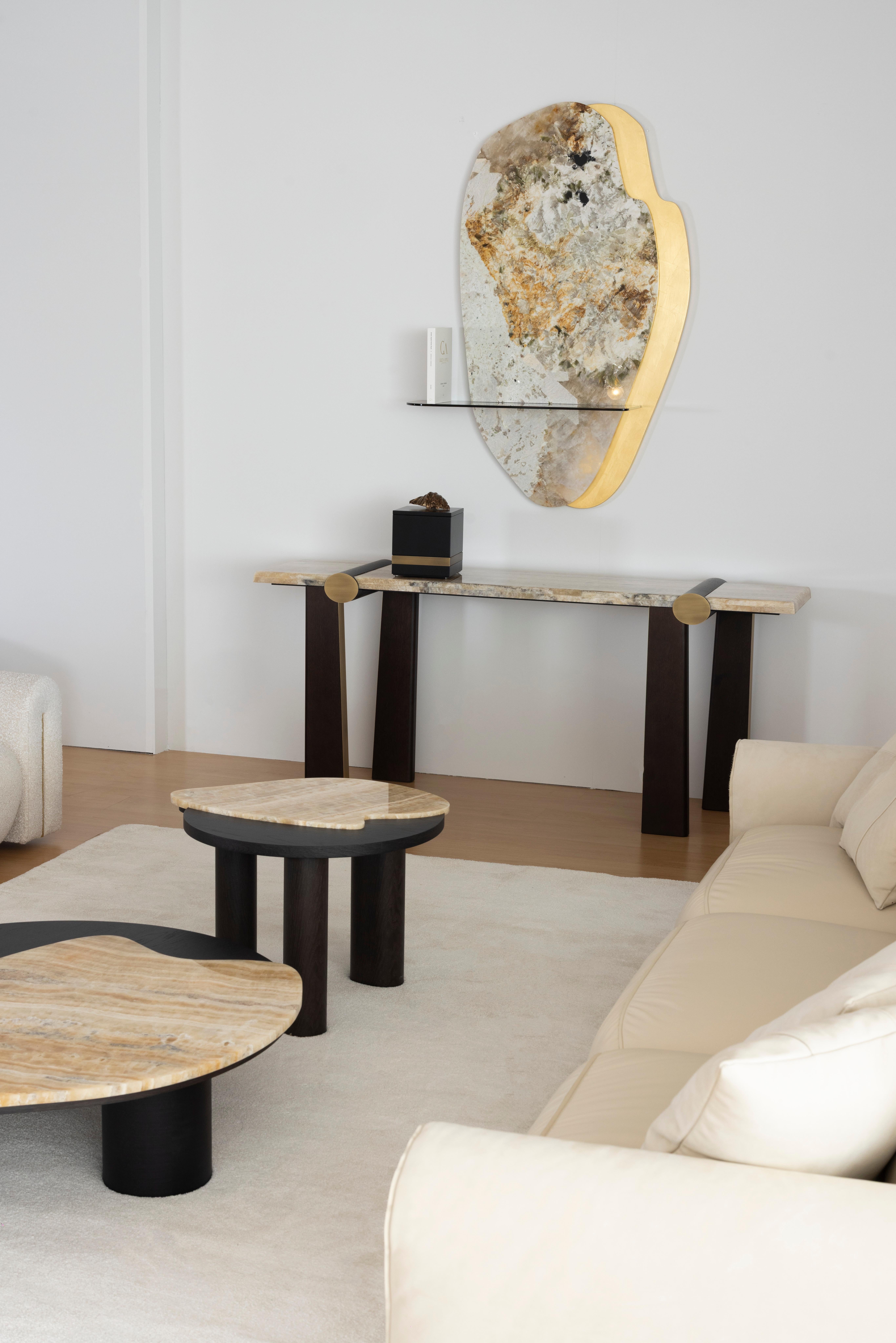 Mira Console, Contemporary Collection, Handcrafted in Portugal - Europe by Greenapple.

The Mira onyx console table stands out as a bold expression of modern sophistication. Inspired by the captivating Grutas de Mira de Aire, its irregular design