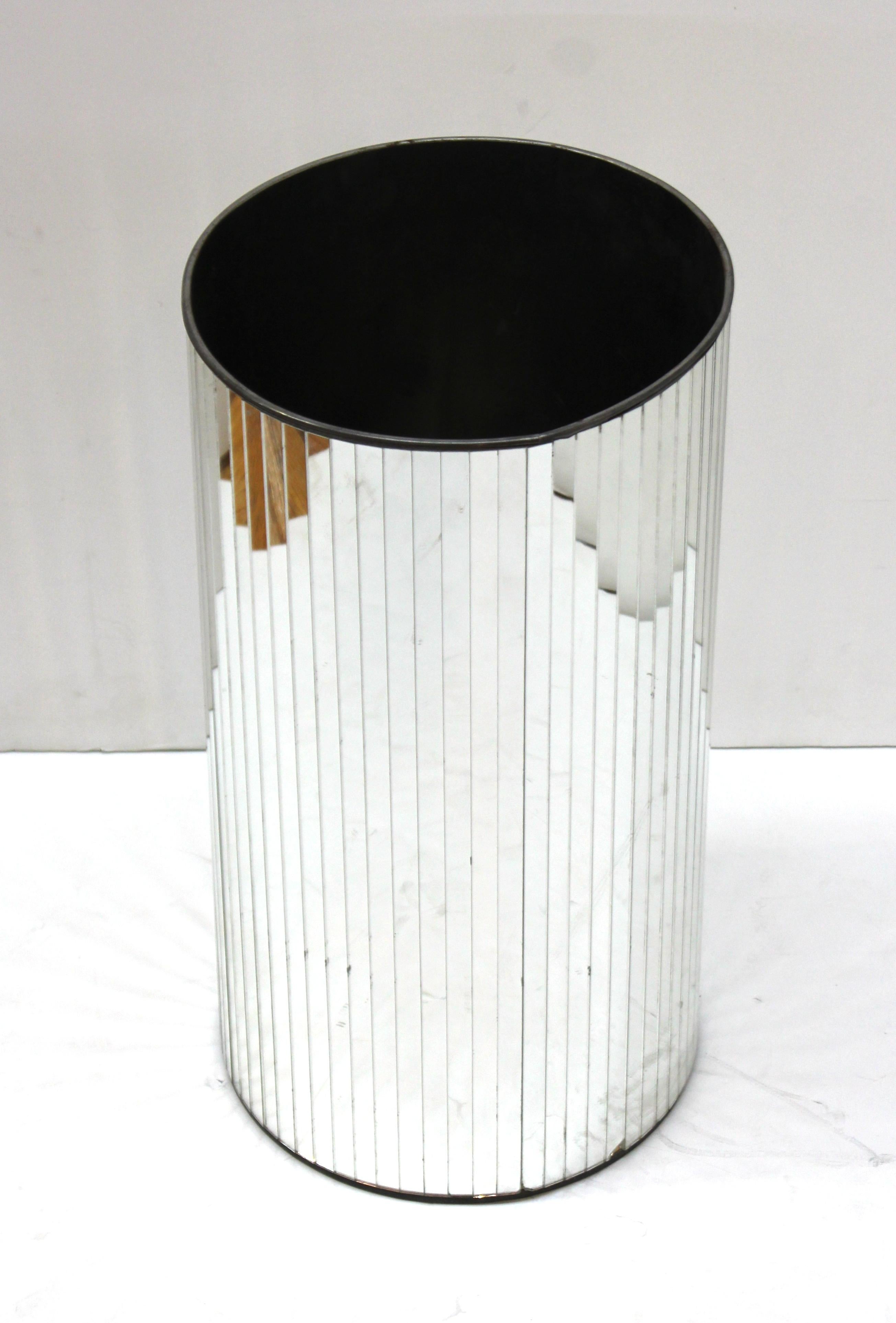 Modern cylindrical umbrella stand or dust bin with an exterior of applied faceted mirrors. The piece has an illegible makers mark on the bottom. In great vintage condition with age-appropriate wear and use.