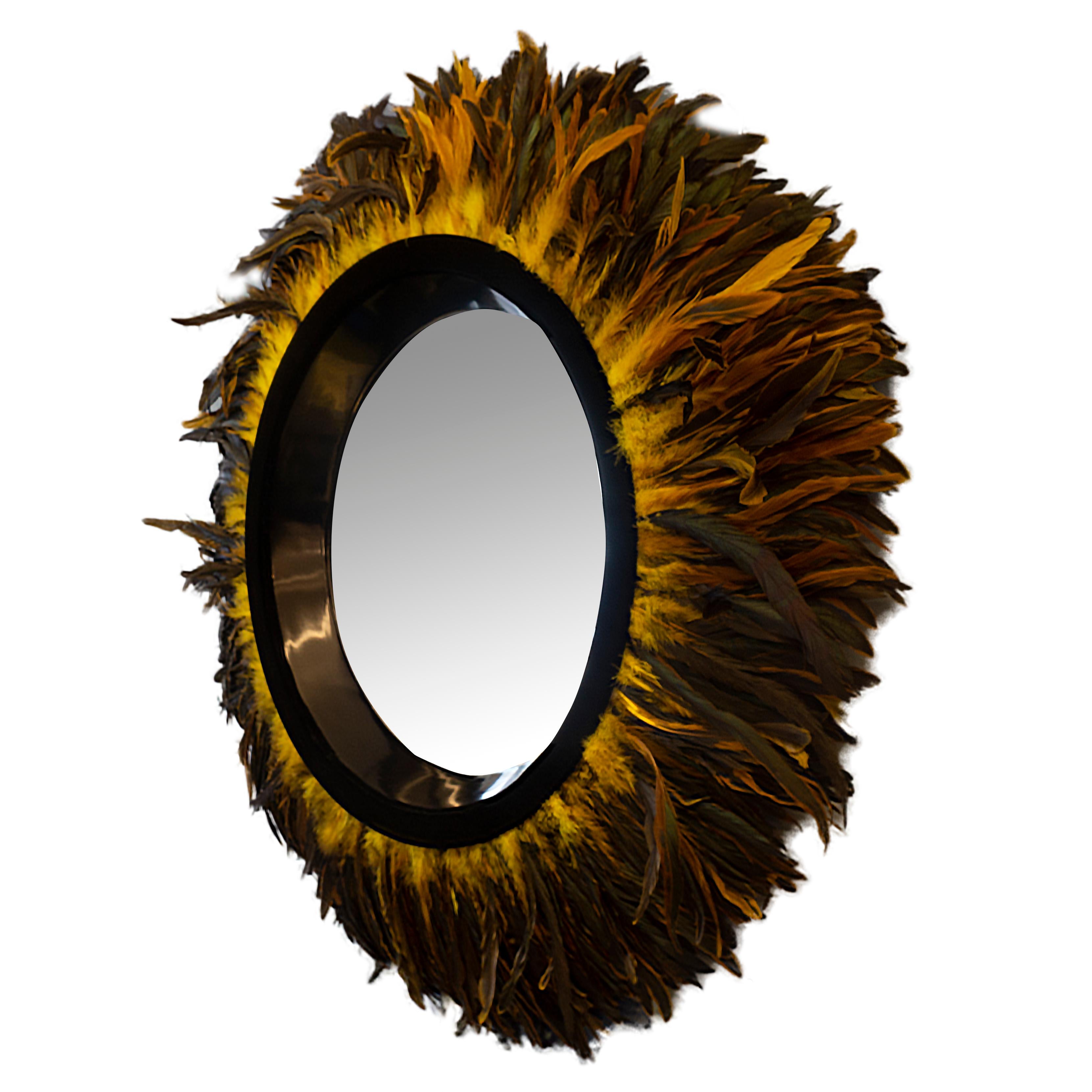 This modern statement mirror was handcrafted at our studio in Norwalk, Connecticut. It features a trim made of gold or bronze Coque feathers. 

Measurements: 35” diameter.