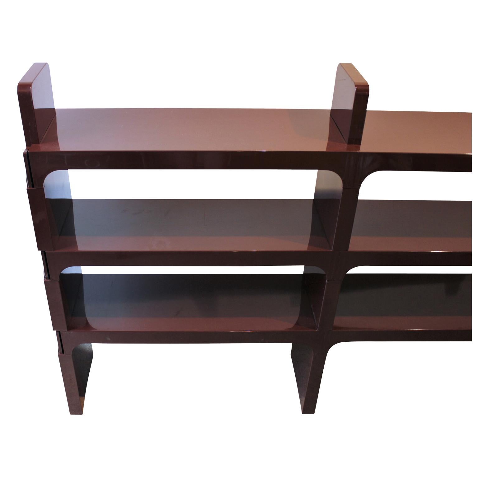 Trendy modern Kartell Milano modular bookshelf. It is made of molded plastic and by Olaf Von Bohr. Each shelf section separates for easy transport or to build onto another modular piece.