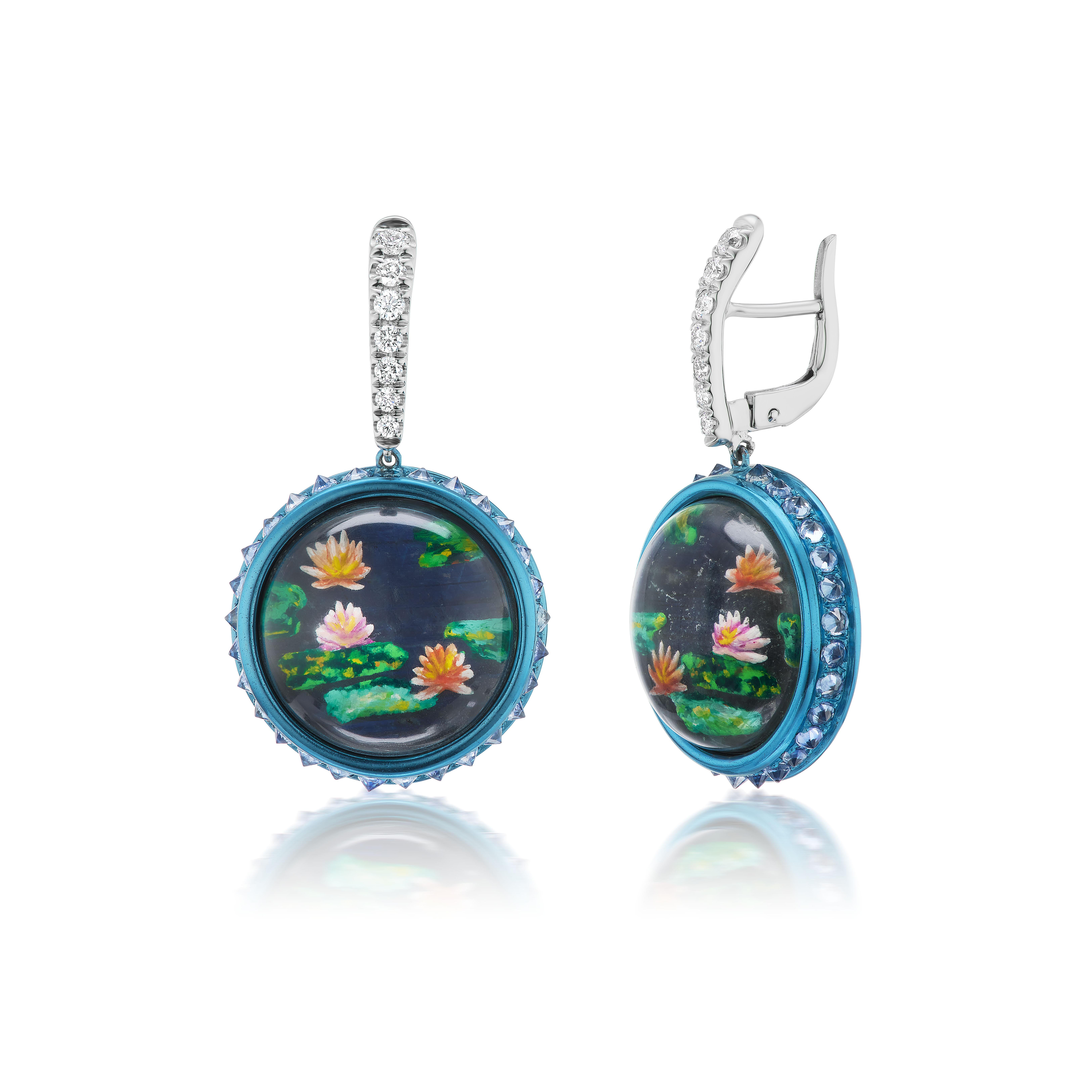 Claude Monet's paintings of water lilies are the iconic image of Impressionism and these modern earrings are themselves a work of art.  As a tribute to Monet, the painting is done utilizing the centuries old Essex crystal technique in which the rock