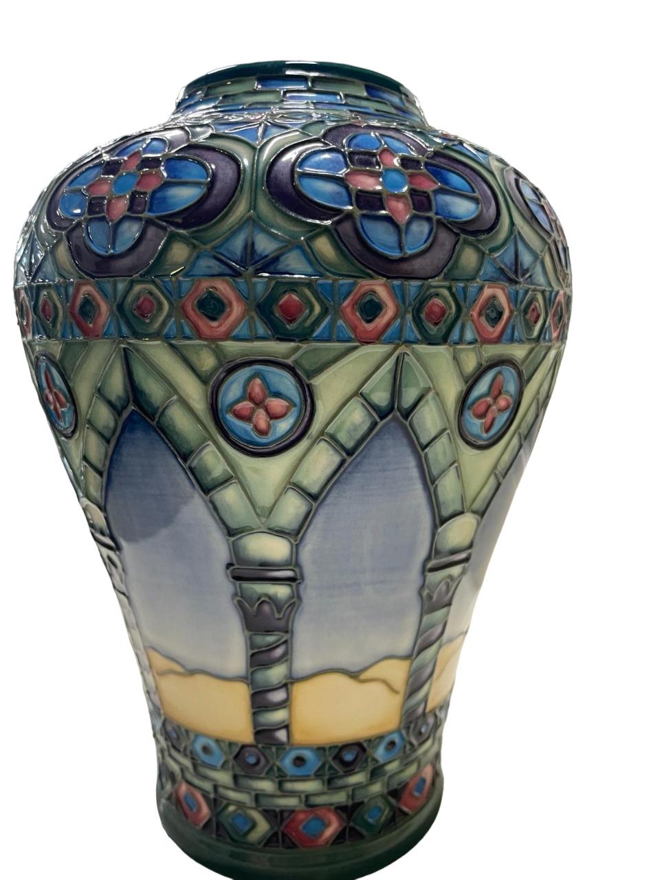 A Modern Moorcroft Meknes Pattern 576/9 Vase, designed by Beverley Wilkes, impressed and painted factory marks, numbered 66/350, underglaze and gold pen.
Lovely Moorcroft Arabic ‘Meknes Vase’ designed by Beverley Wilkes, with tube-line decoration.