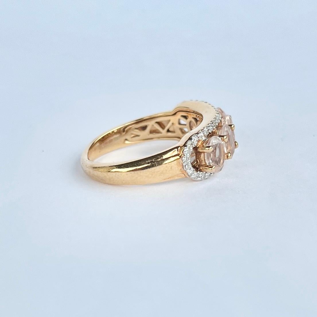 This 9 carat gold five stone ring holds five pale pink morganite stones and they are surrounded by a halo of small yet sparkly diamonds. The morganite measure 40pts each and the diamond total is 45pts. 

Ring Size: N or 6 3/4
Face Width: 8mm
Height
