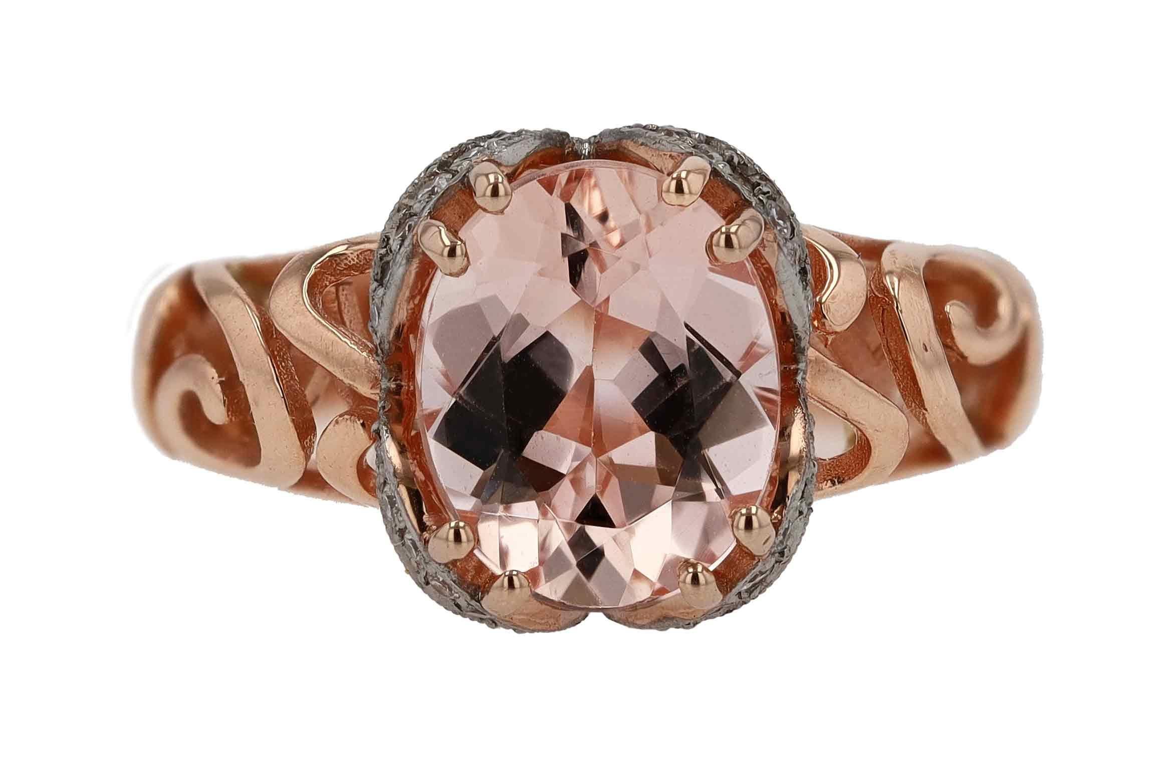 This unforgettable modern morganite cocktail ring is an affordable jewel from our Bella Rosa Galleries design team. Handcrafted 14 karat rose gold features broad filigree open work. This stunning gemstone creation doubles as an engagement or wedding