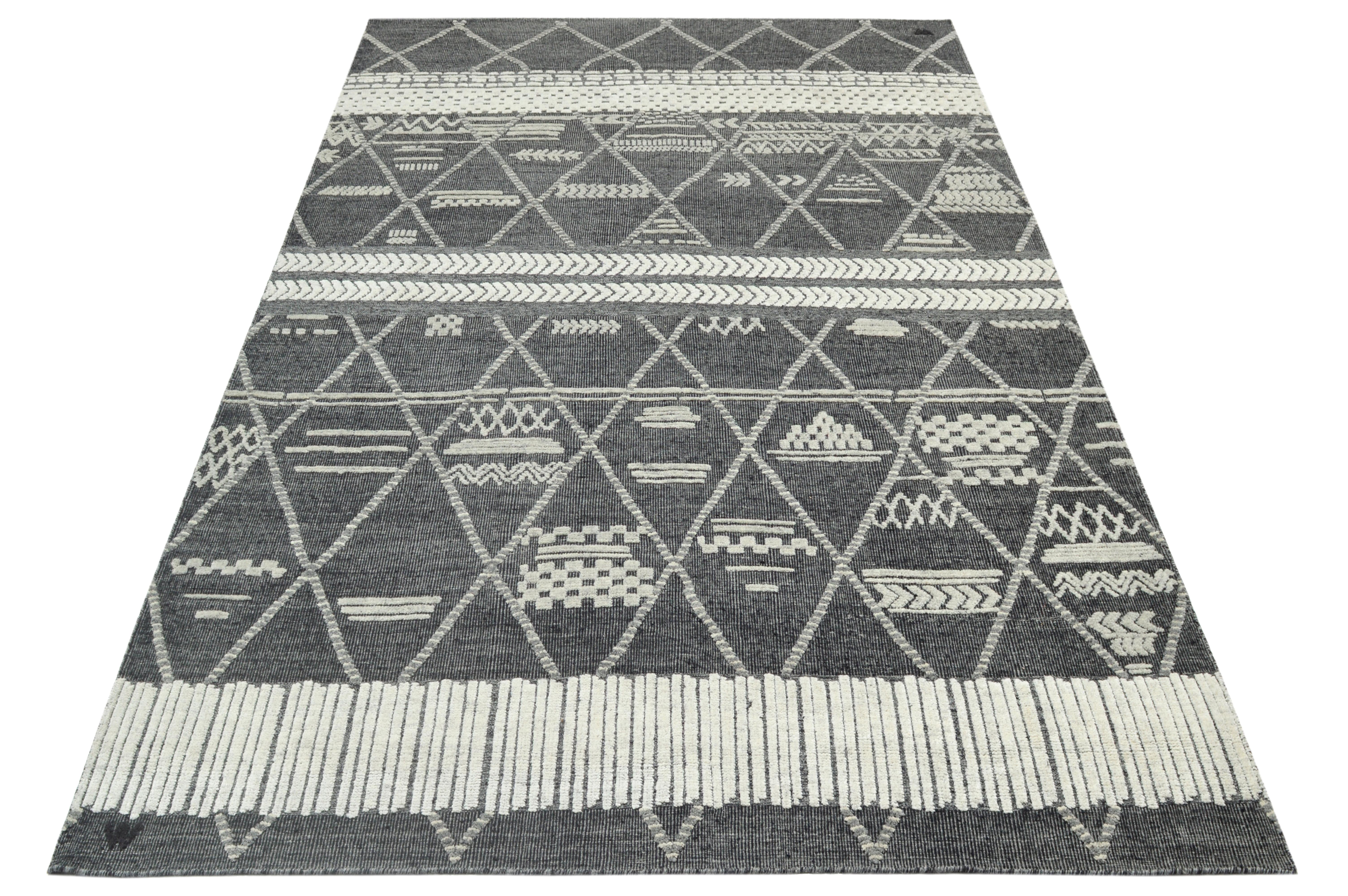 Hand-knotted wool pile on a cotton foundation.

Approximate Dimensions: 10' x 14'

Origin: India

Field color: Charcoal 

Accent color: Silver.