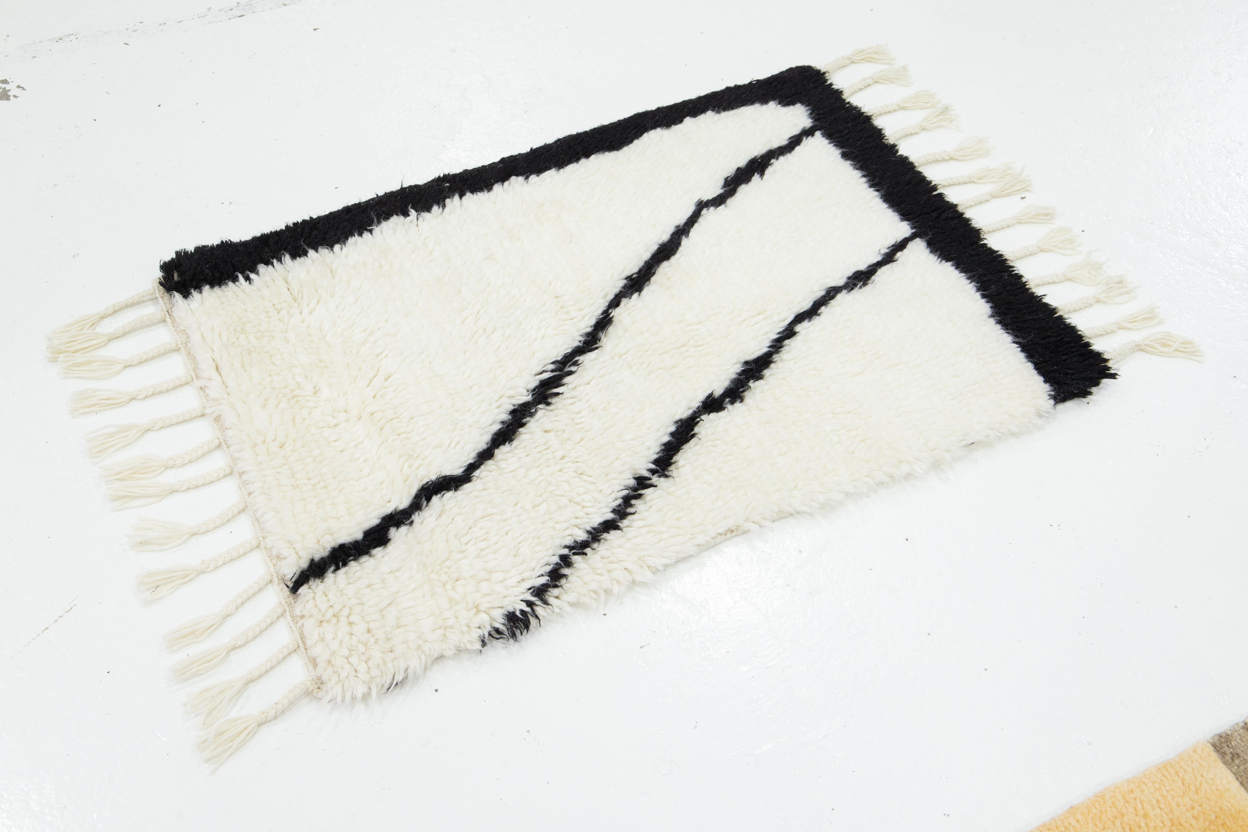 This handcrafted custom wool rug, available in multiple colors, is part of our Safi Collection. We use hand-knotted techniques for superior quality and longevity. 
The estimated lead time for customs is 15-20 weeks.
Material: Wool
Techniques: