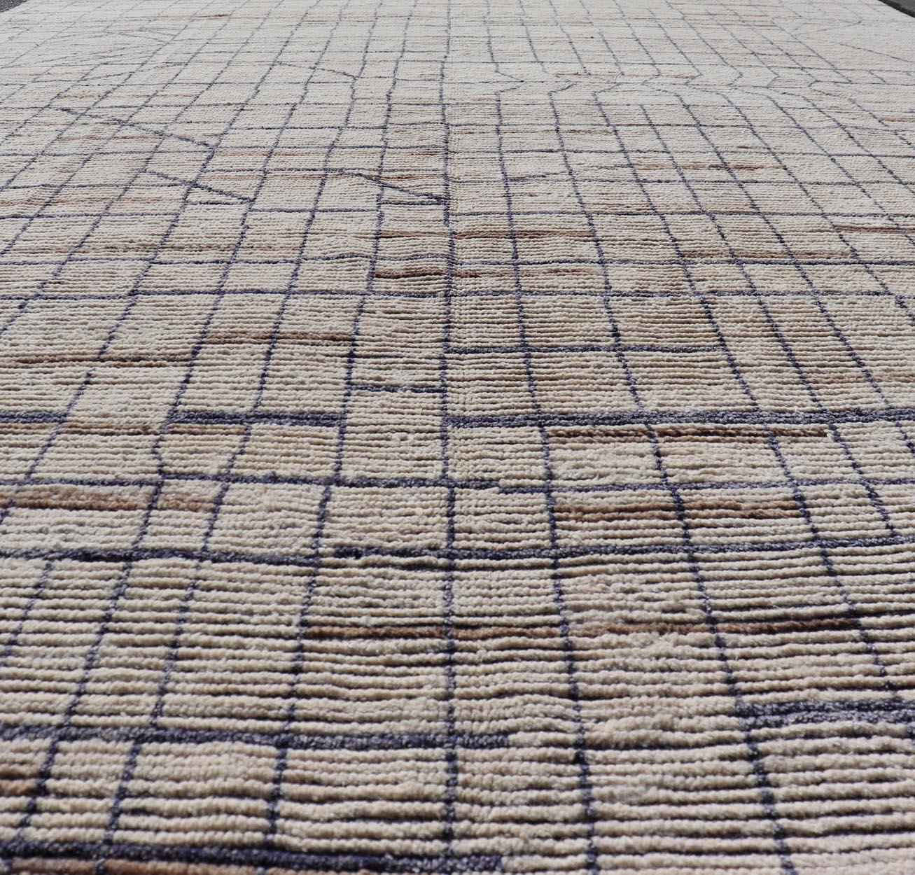 Modern Moroccan Rug in Neutral Tones with Subdued Design with Pops of Blue. Keivan Woven Arts / rug MSE-12575, country of origin / type: Afghanistan / Rug Early 21st Century. 
Measures: 9'10 x 14'1 
The subdued design of this rug makes it perfect
