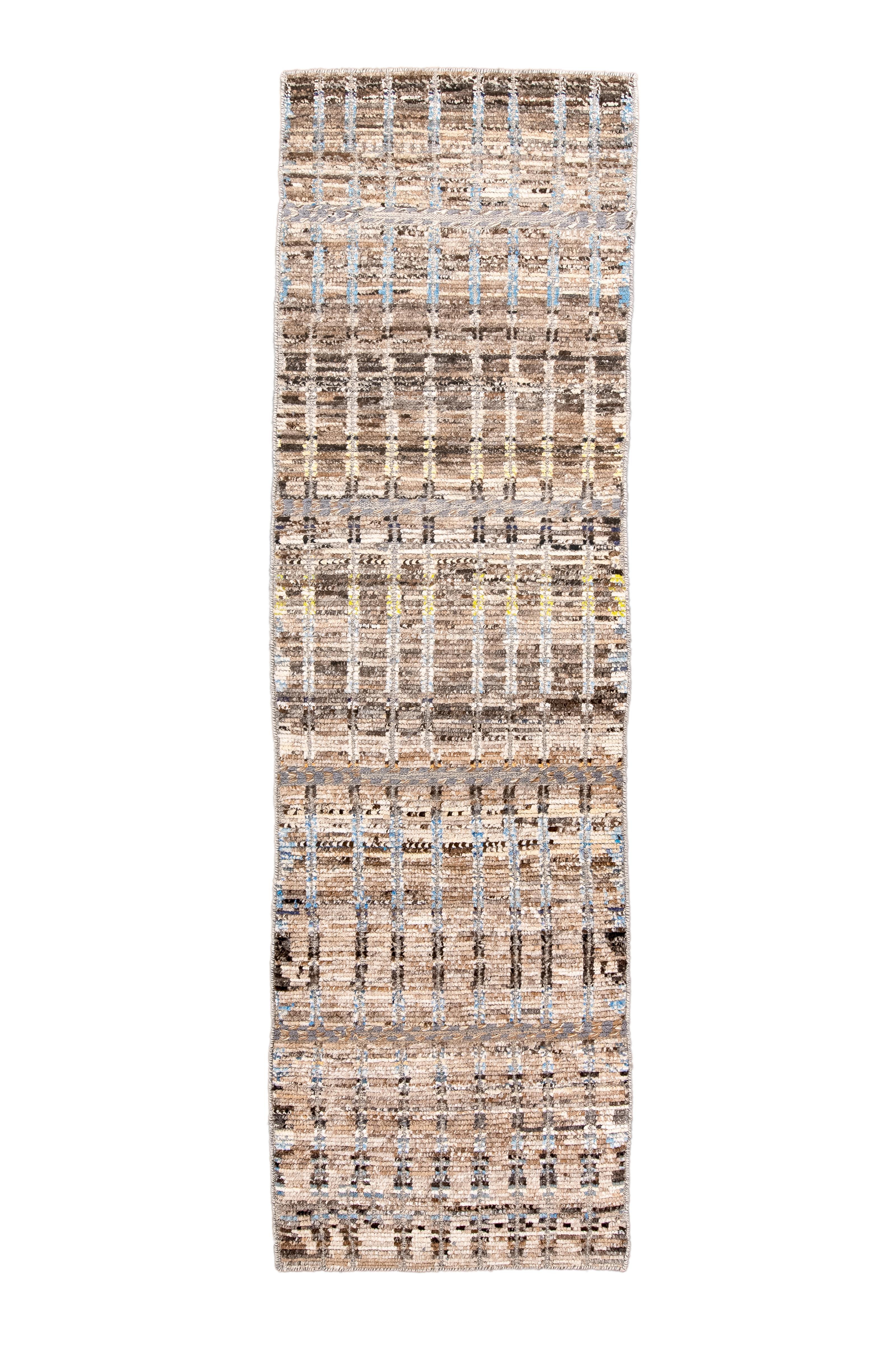 The rustic borderless kenare (runner) combined total abrash with an orthogonal gridwork, with details in innumerable shades of brown. Along with accents in lemon, pale blue and cream. All around overcast.

Rug Size
3x9'7