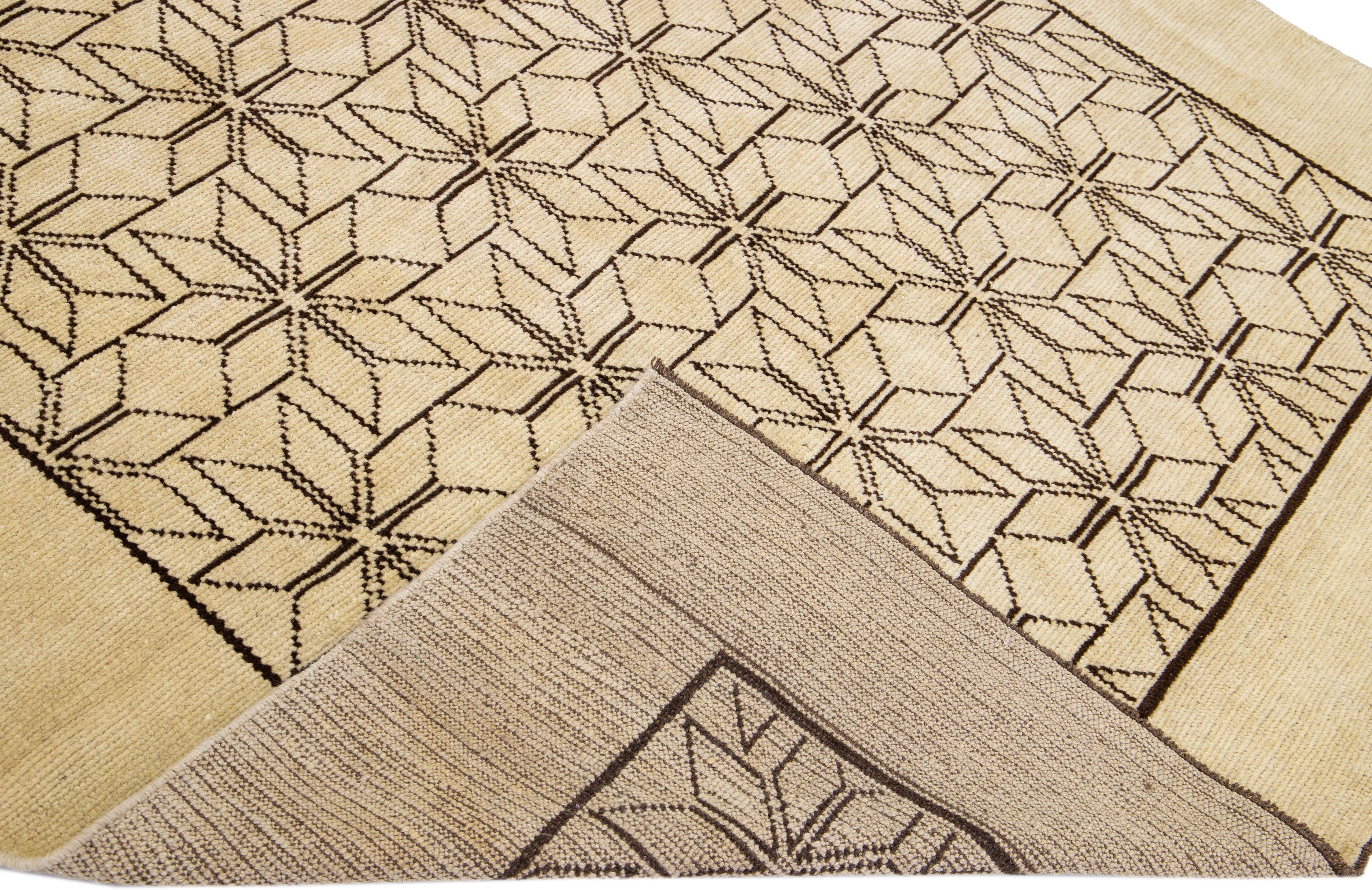 This Beautiful Moroccan-style handmade wool rug makes part of our Northwest collection and features a beige color field and dark brown accents in a gorgeous geometric tribal pattern design.

This rug measures: 6'9