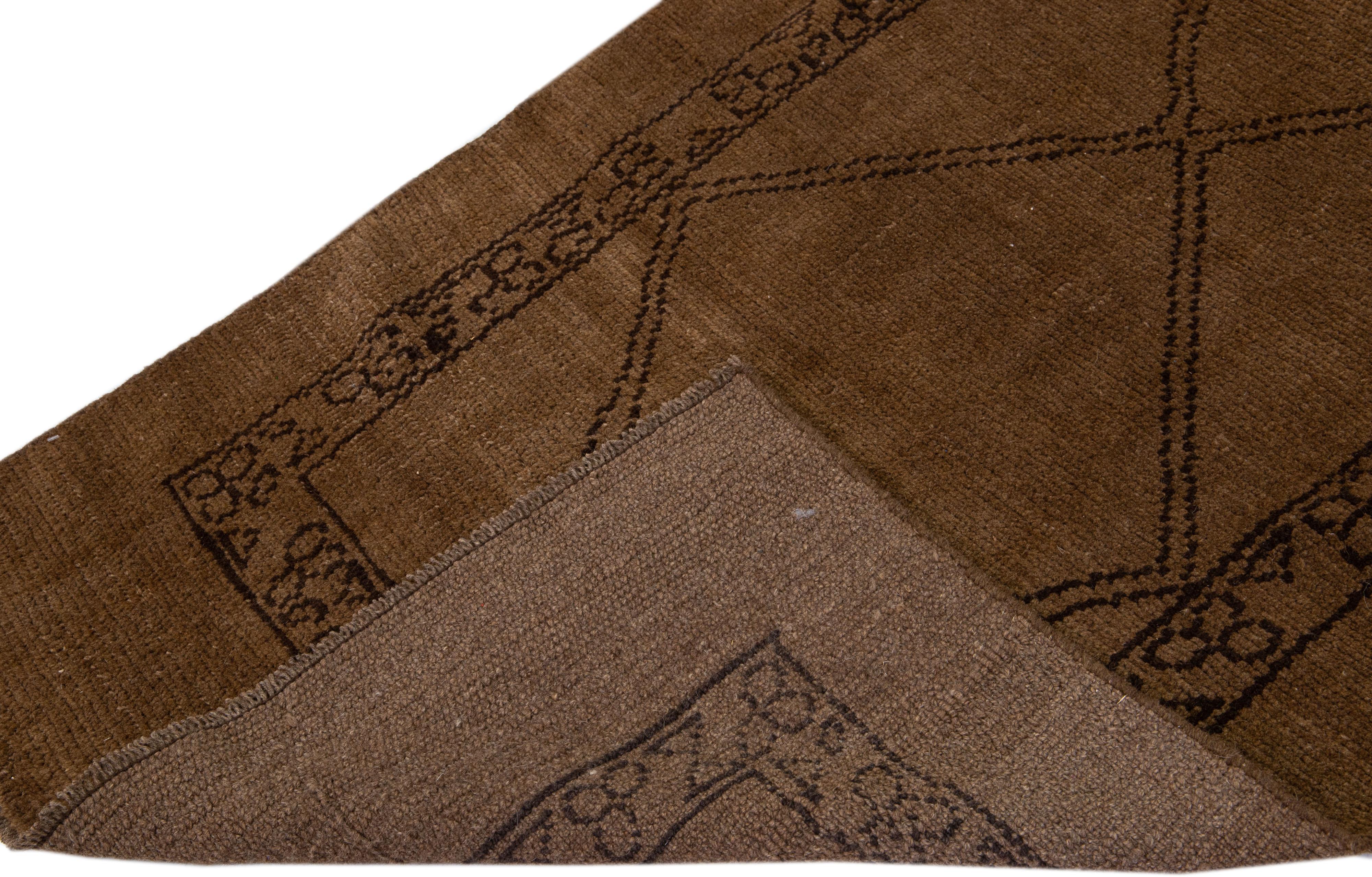 This Beautiful Moroccan-style handmade wool runner makes part of our Northwest collection and features a brown color field and beige accents in a gorgeous geometric tribal design.

This rug measures: 3'4