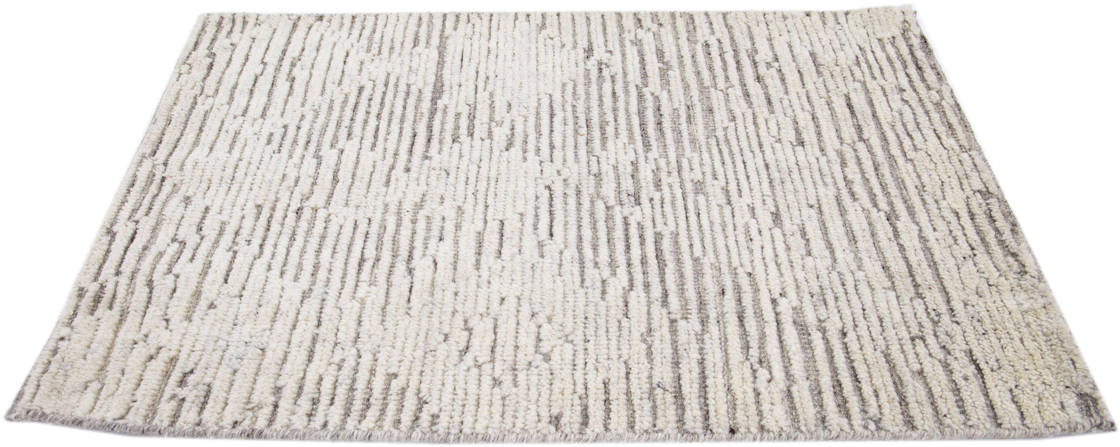 Apadana's Modern Moroccan Style wool custom rug. Custom sizes and colors made-to-order.

Material: 80 Wool and 20 Cotton.
Techniques: Hand-Loomed.
Style: Moroccan.
Lead time: Approx. 15-16 weeks available.
Colors: As shown, other custom colors are
