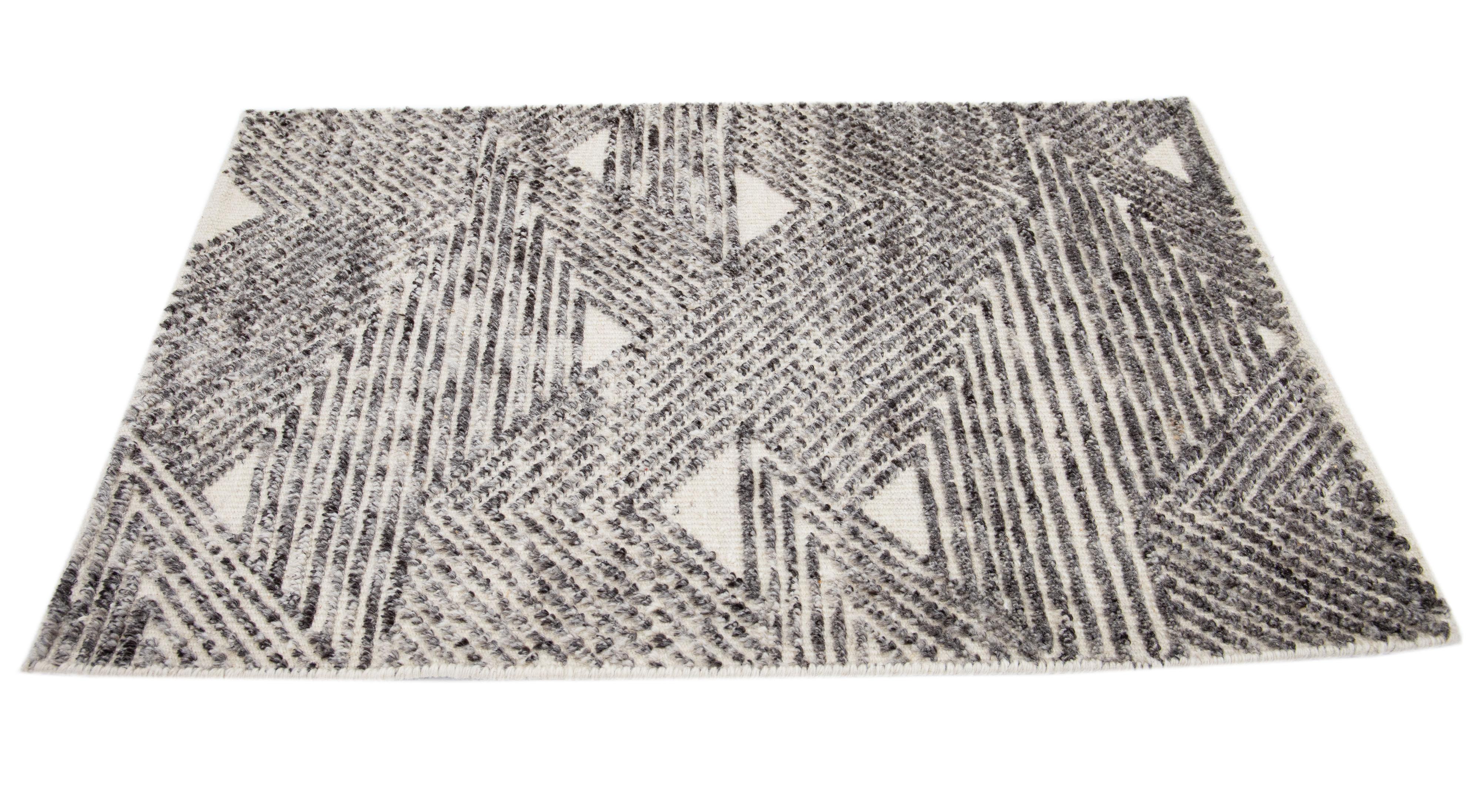Apadana's Modern Moroccan Style wool custom rug. Custom sizes and colors made-to-order.

Material: 80 Wool and 20 Cotton.
Techniques: Hand-Loomed.
Style: Moroccan.
Lead time: Approx. 15-16 weeks available.
Colors: As shown, other custom colors are