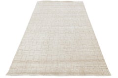 Alfombra de estilo marroquí moderno, tejida a mano con lana y viscosa, en tonos crema y marfil