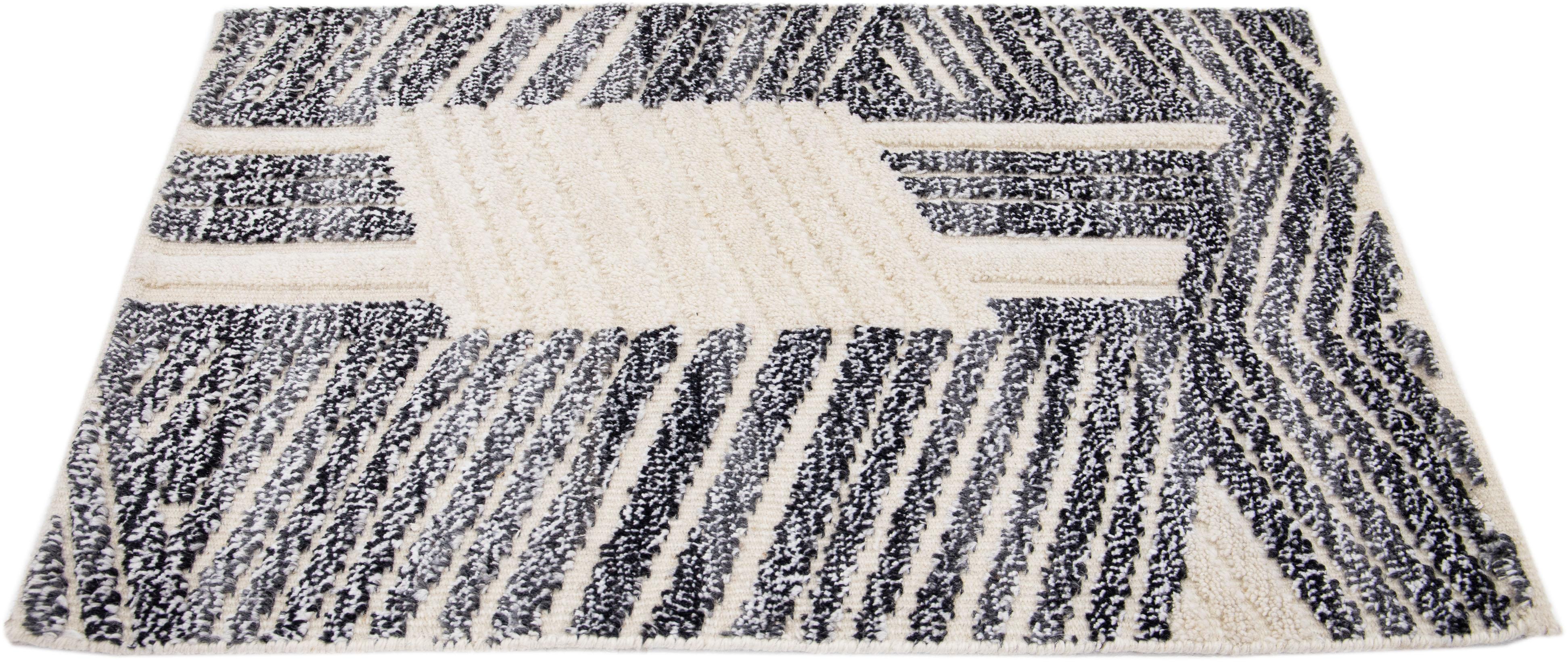 Apadana's Modern Moroccan Style wool custom rug. Custom sizes and colors made-to-order.

Material: 80 Wool and 20 Cotton.
Techniques: Hand-Loomed.
Style: Moroccan.
Lead time: Approx. 15-16 weeks available.
Colors: As shown, other custom colors are