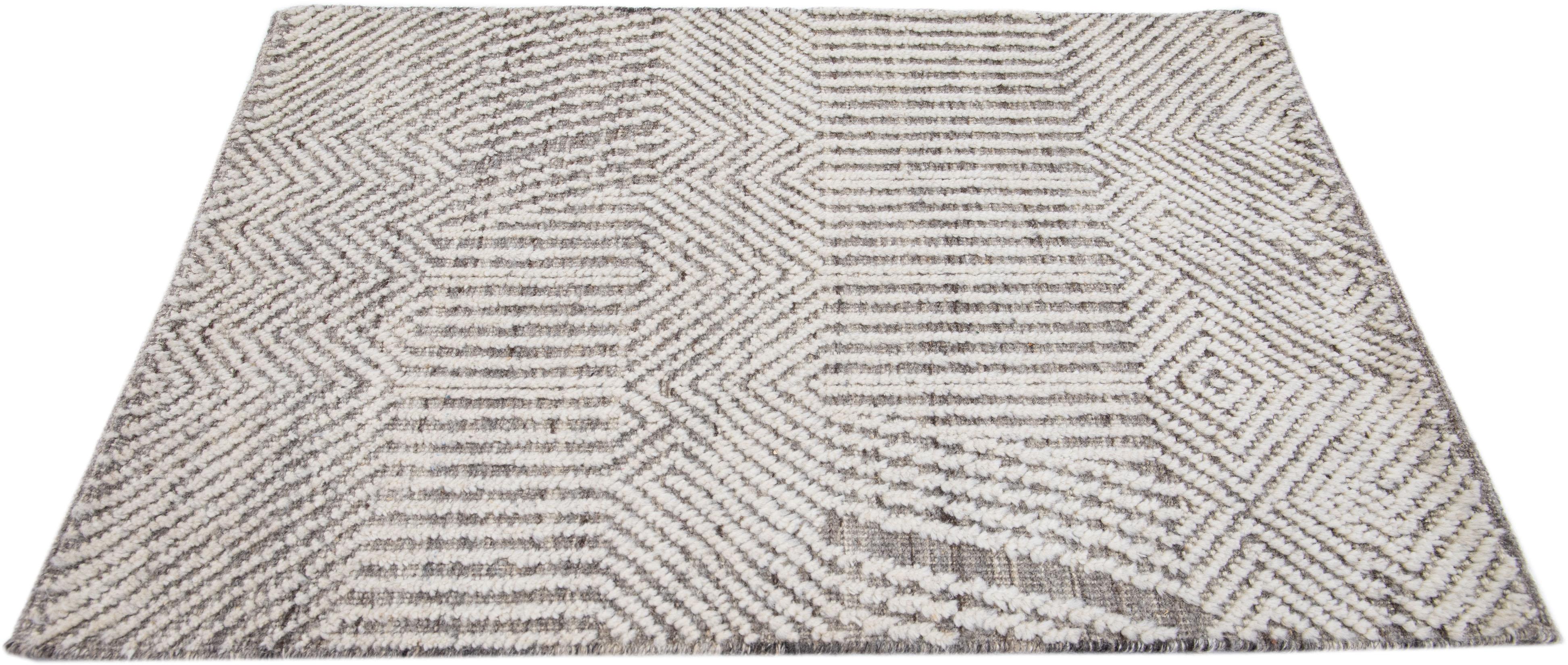 Apadana's Modern Moroccan Style wool custom rug. Custom sizes and colors made-to-order.

Material: 80 Wool and 20 Cotton.
Techniques: Hand-Loomed.
Style: Moroccan.
Lead time: Approx. 15-16 weeks available.
Colors: As shown, other custom colors are