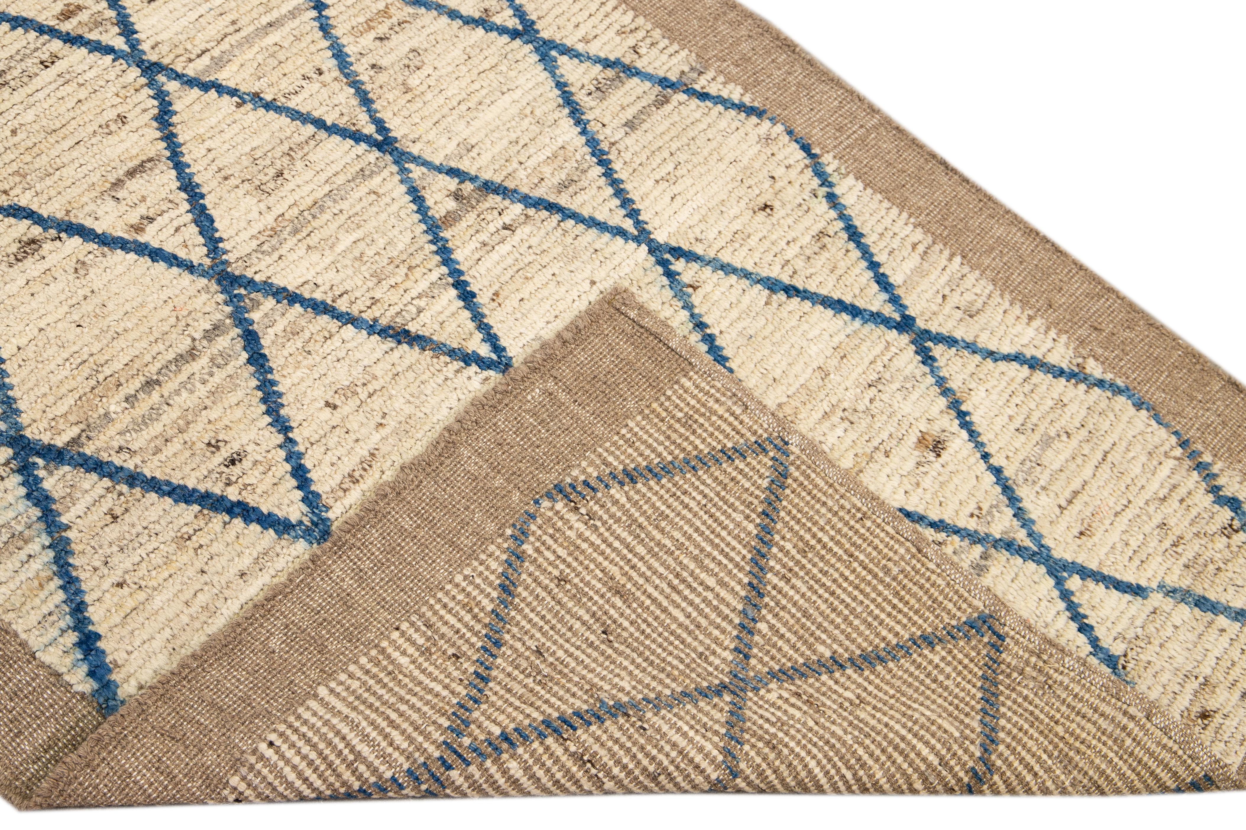 Beautiful Moroccan style handmade wool rug with a beige field. This Modern rug has blue accents featuring a gorgeous all-over bohemian tribal design.

This rug measures: 3'6