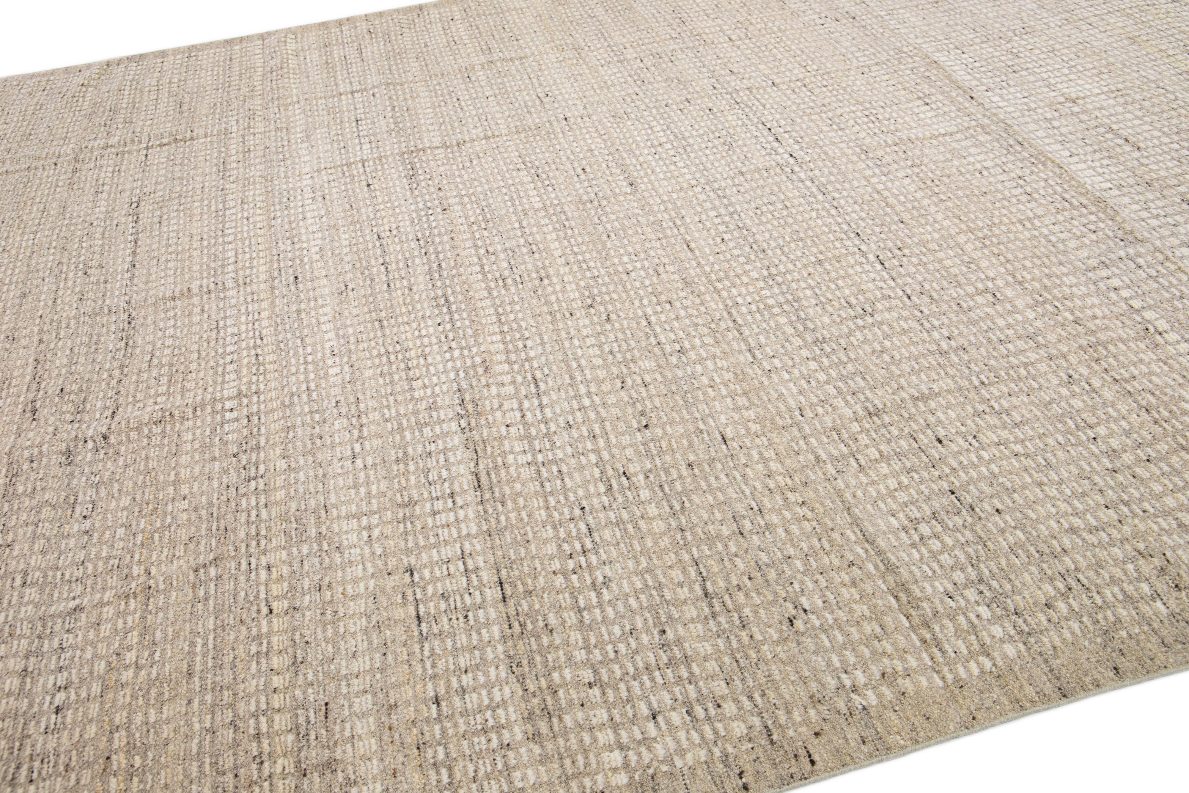 Contemporary Modern Moroccan Style Handmade Subtle Pattern Beige Wool Rug For Sale