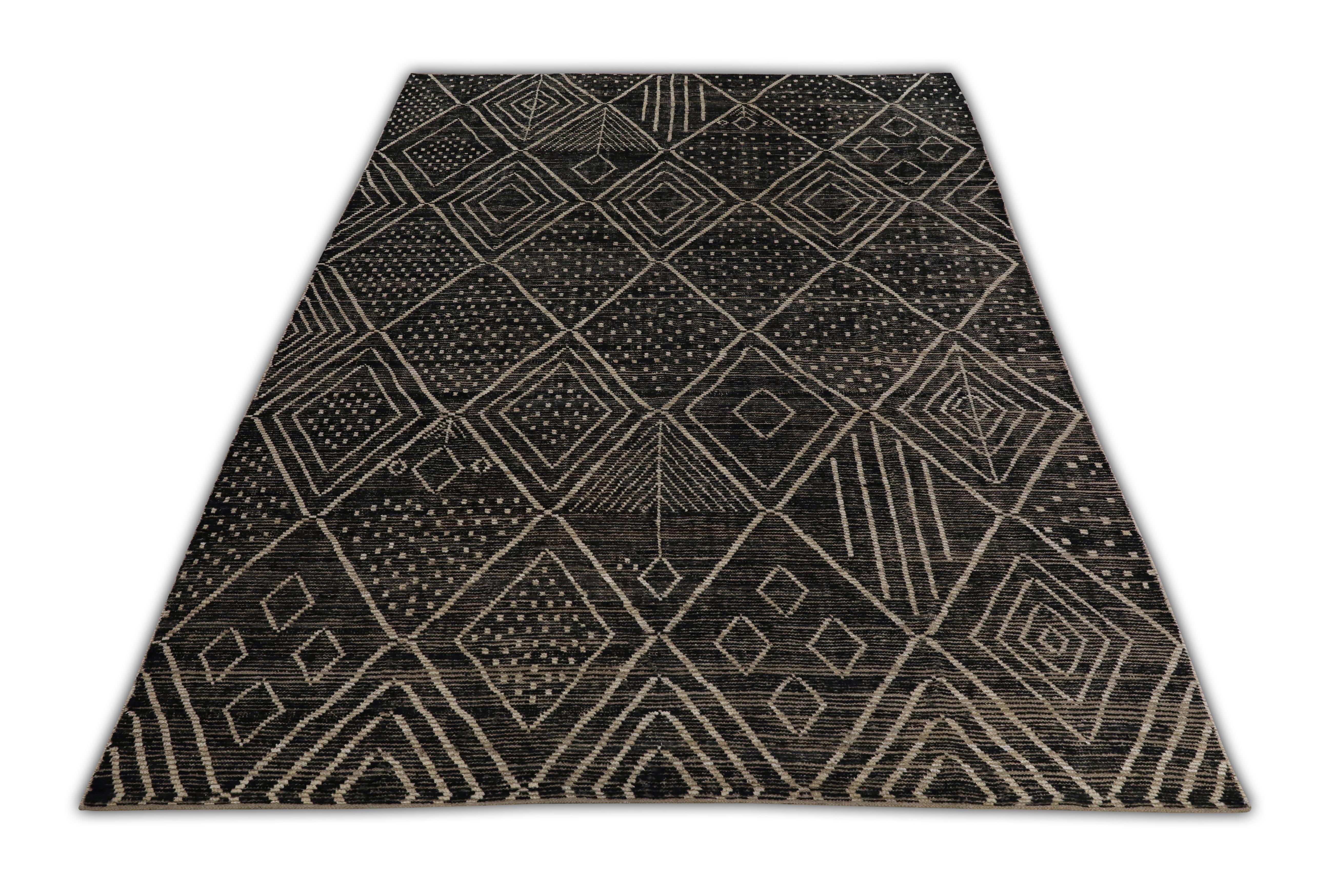 Introducing our exquisite handwoven wool modern Moroccan-style rug, a stunning blend of traditional craftsmanship and contemporary design. Measuring 10'1